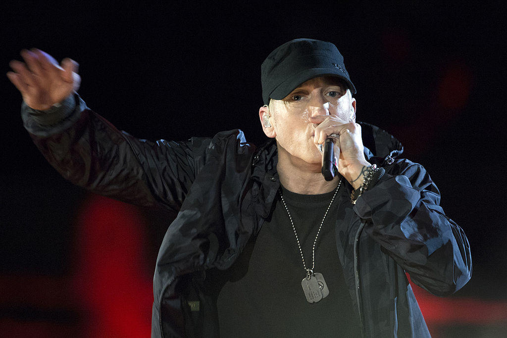 Eminem rapping on stage.