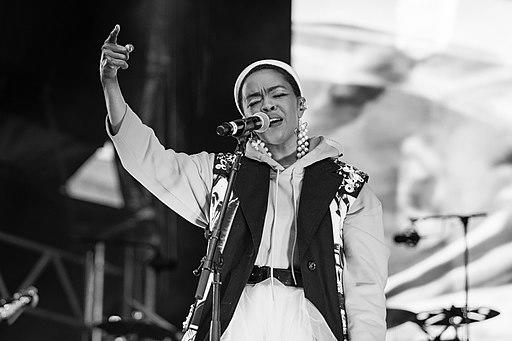 Lauryn Hill performing on stage.