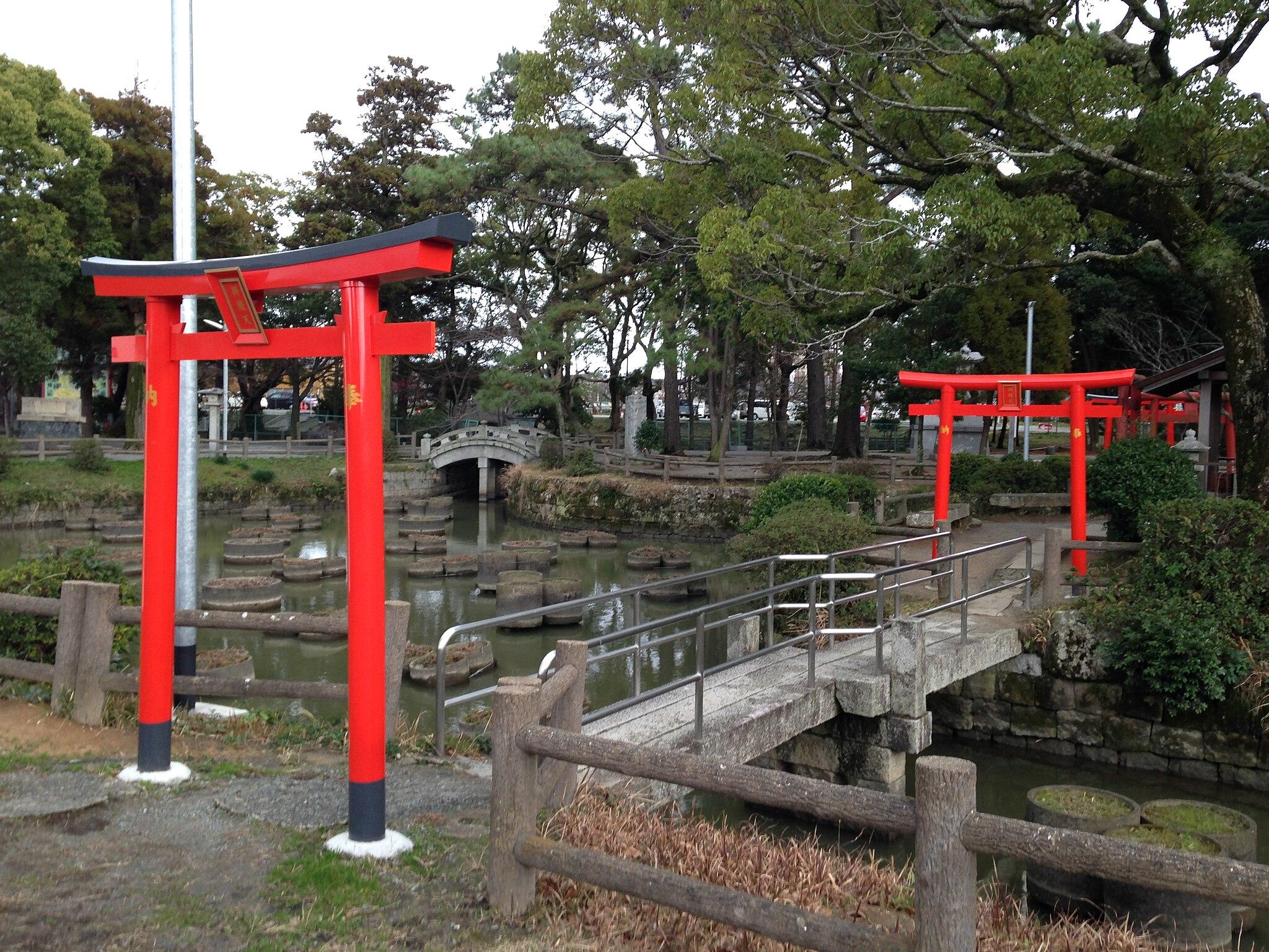Red shrines by the water.