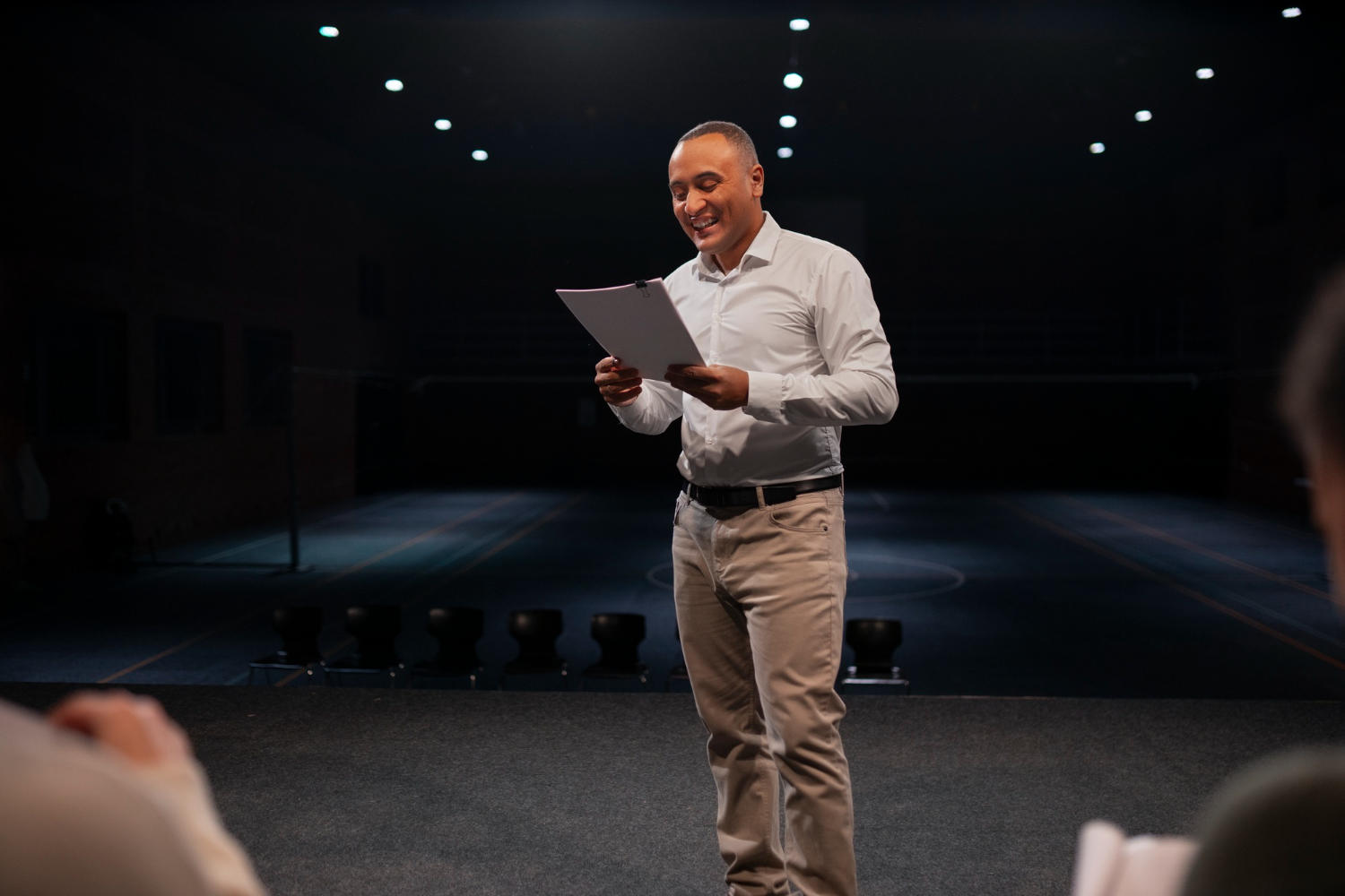 An actor auditioning in front of a panel.