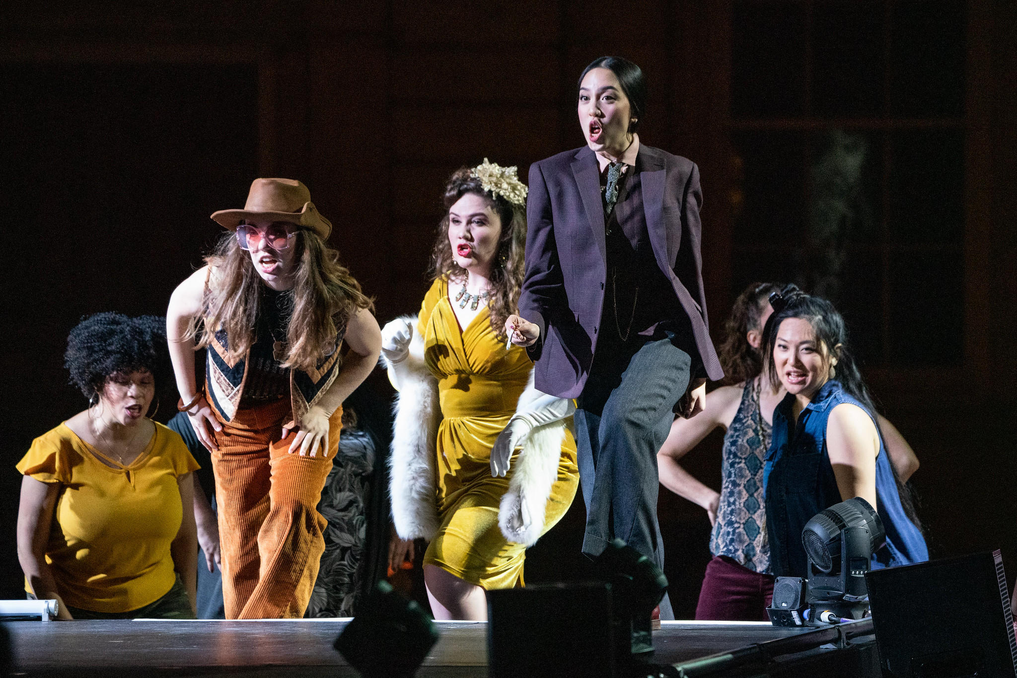 Juilliard students singing and acting in a play.