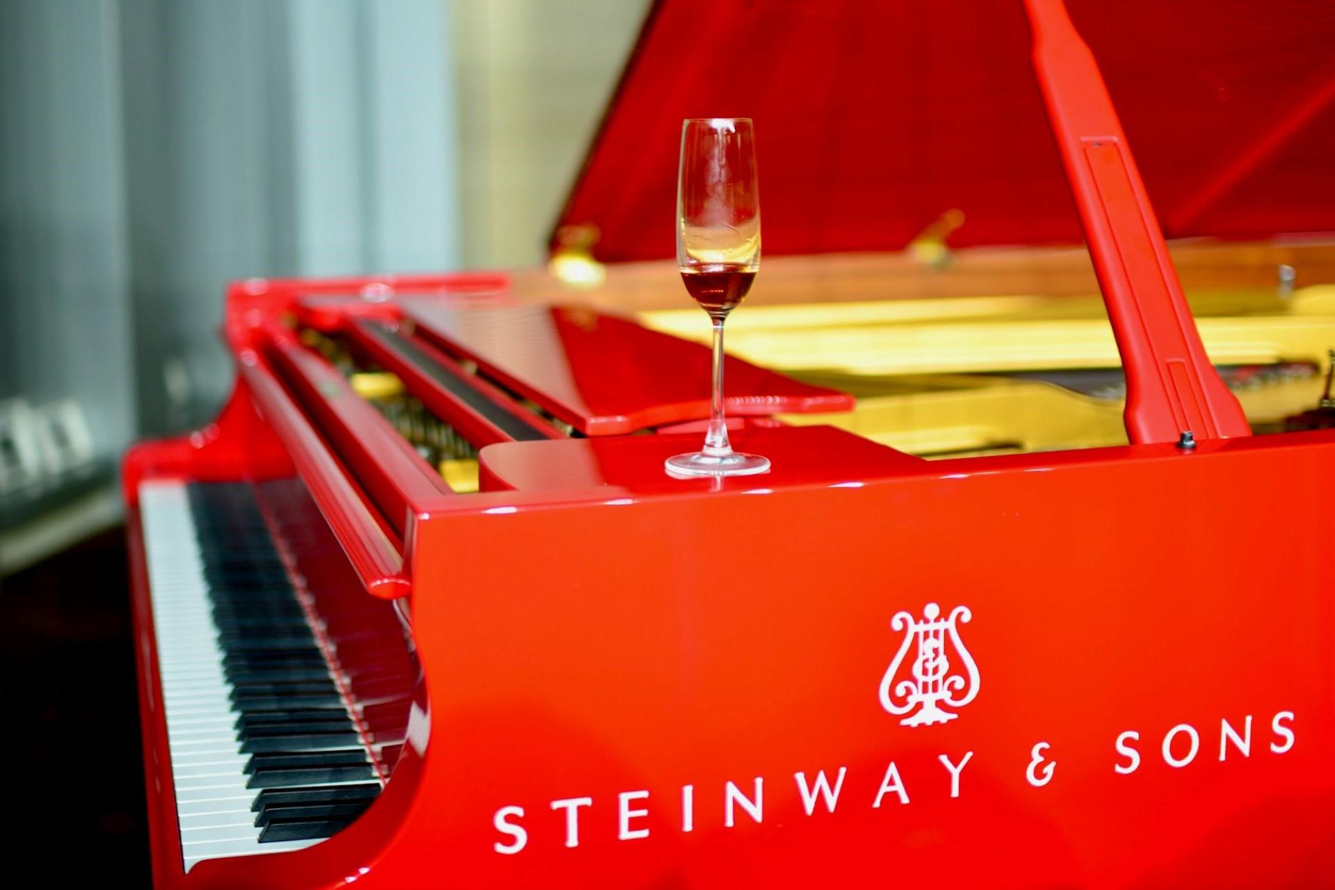 A red Steinway piano.