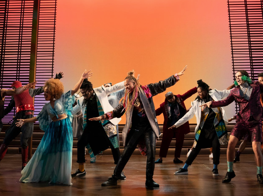 Yale students singing and dancing on stage.