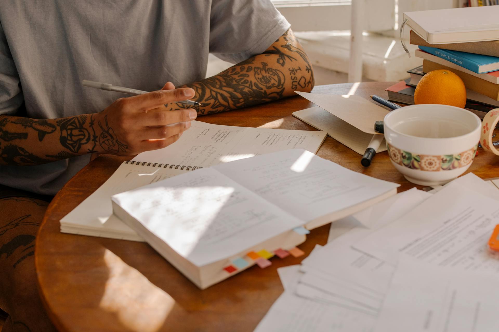 A man at a table studies for an exam