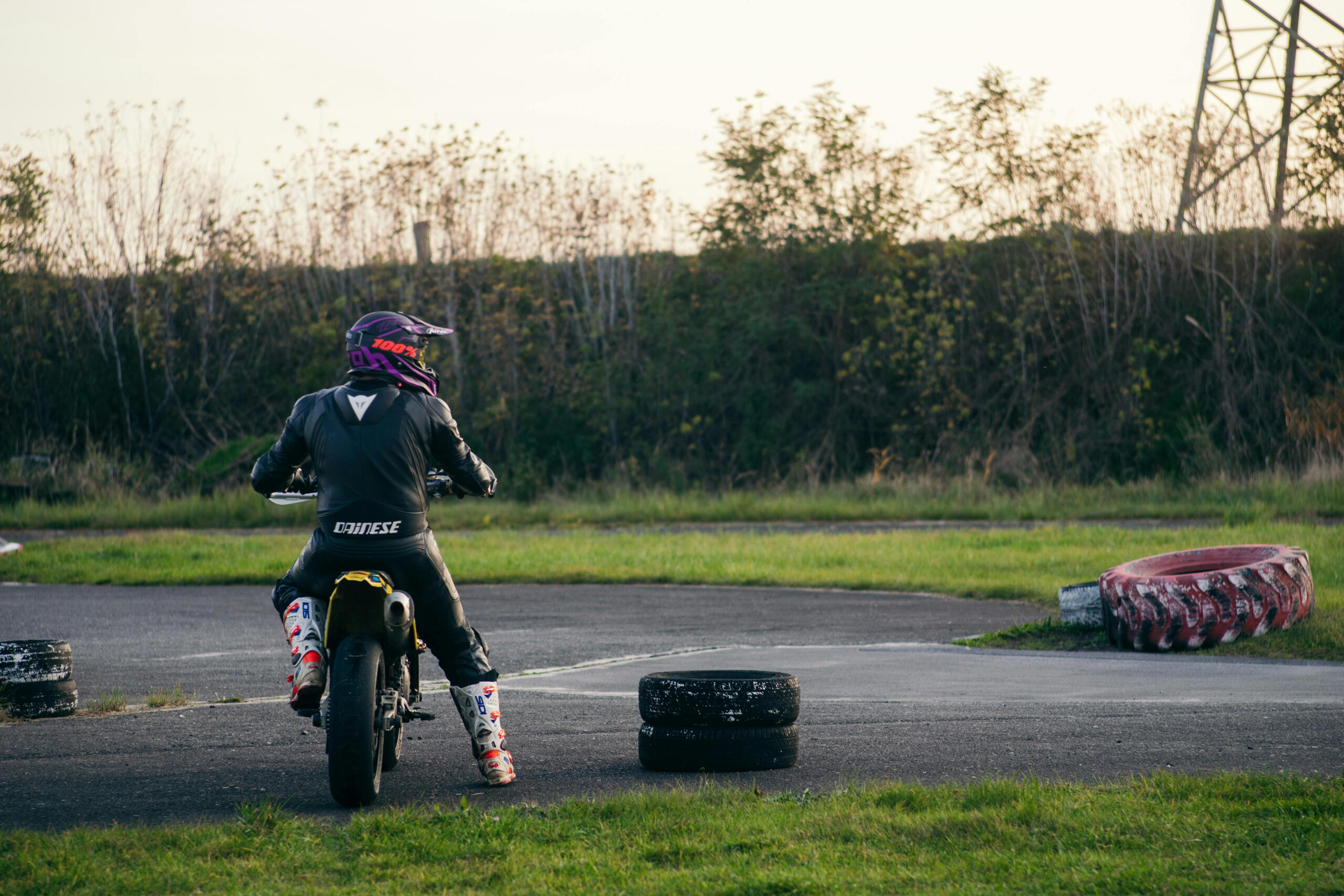 Man in black jacket riding a motorcycle