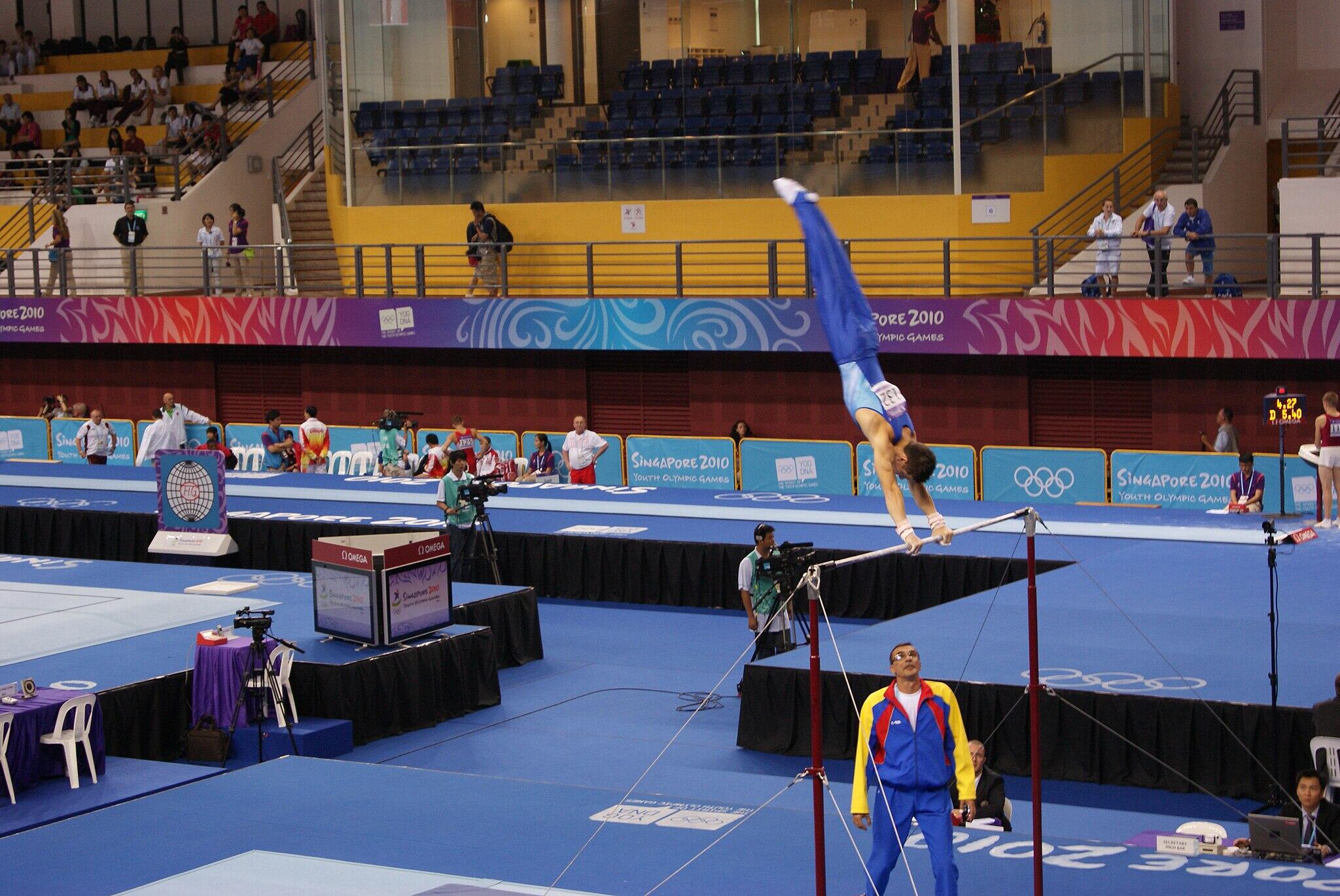 Andrei Muntean performing on the horizontal bar.