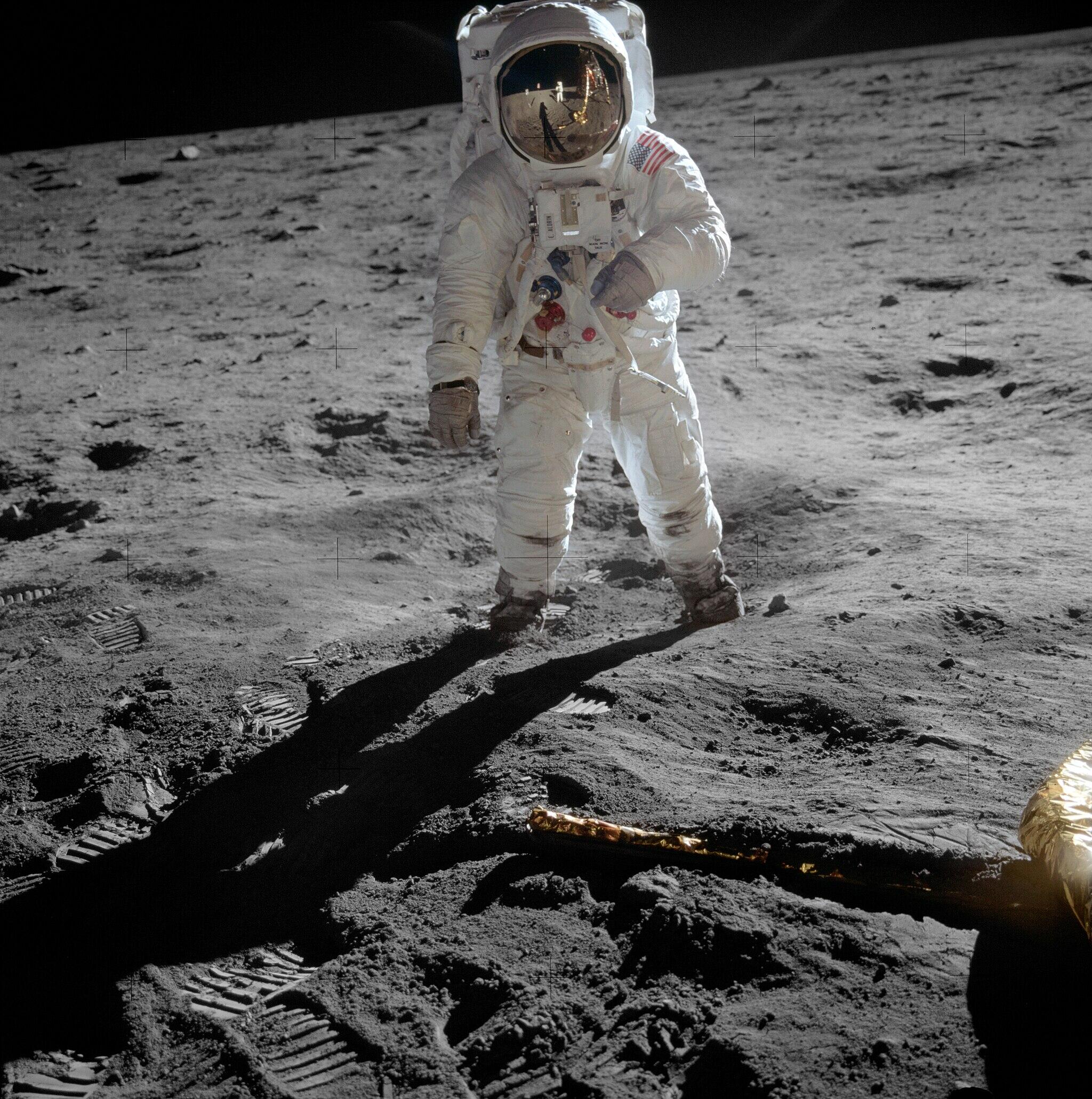 A color photo of Buzz Aldrin in his space suit on the moon.