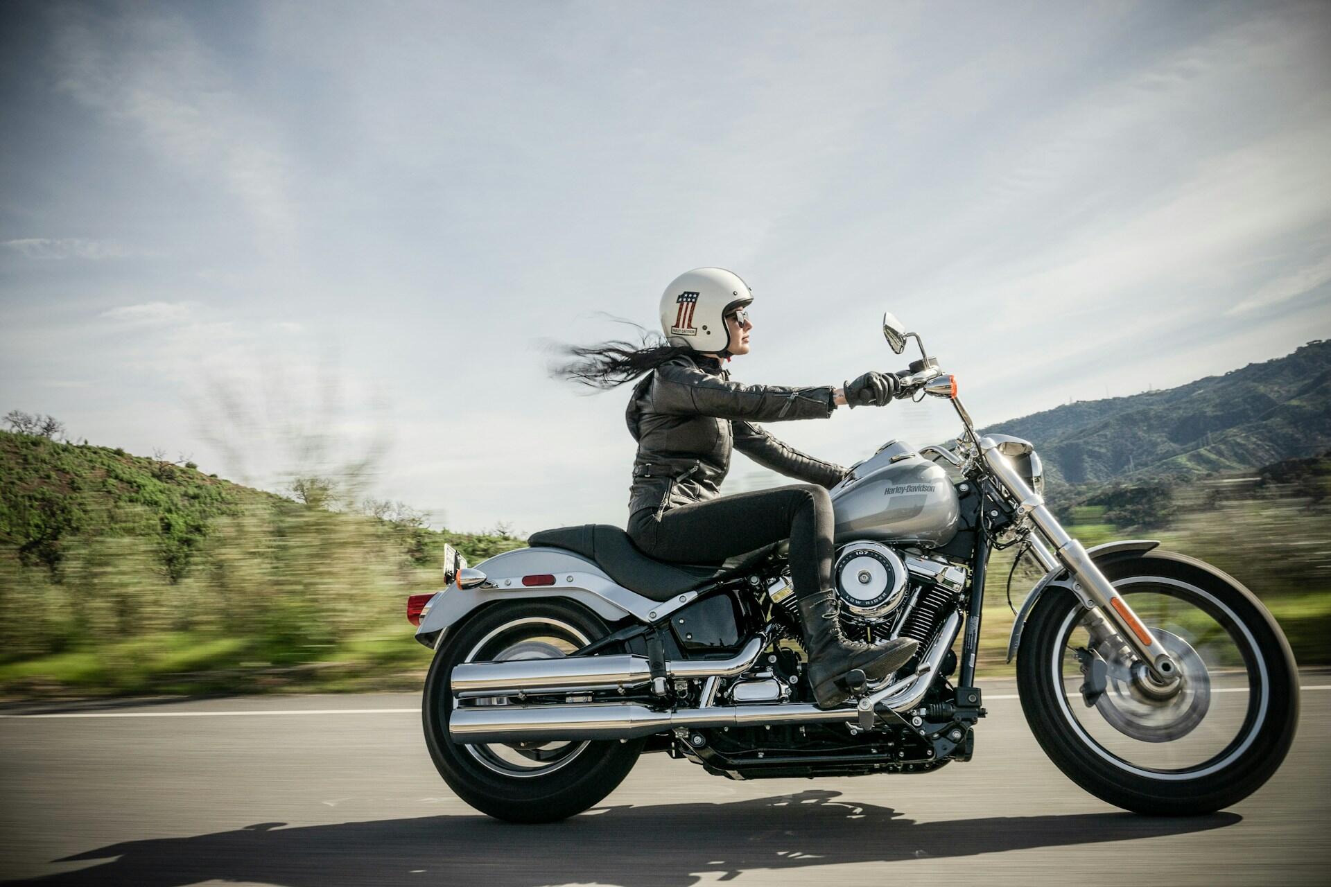 A women driving a motorcycle.