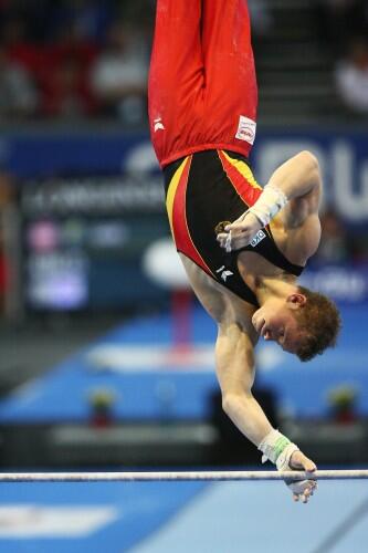 Fabian Hambüchen performing a horizontal bar routine.