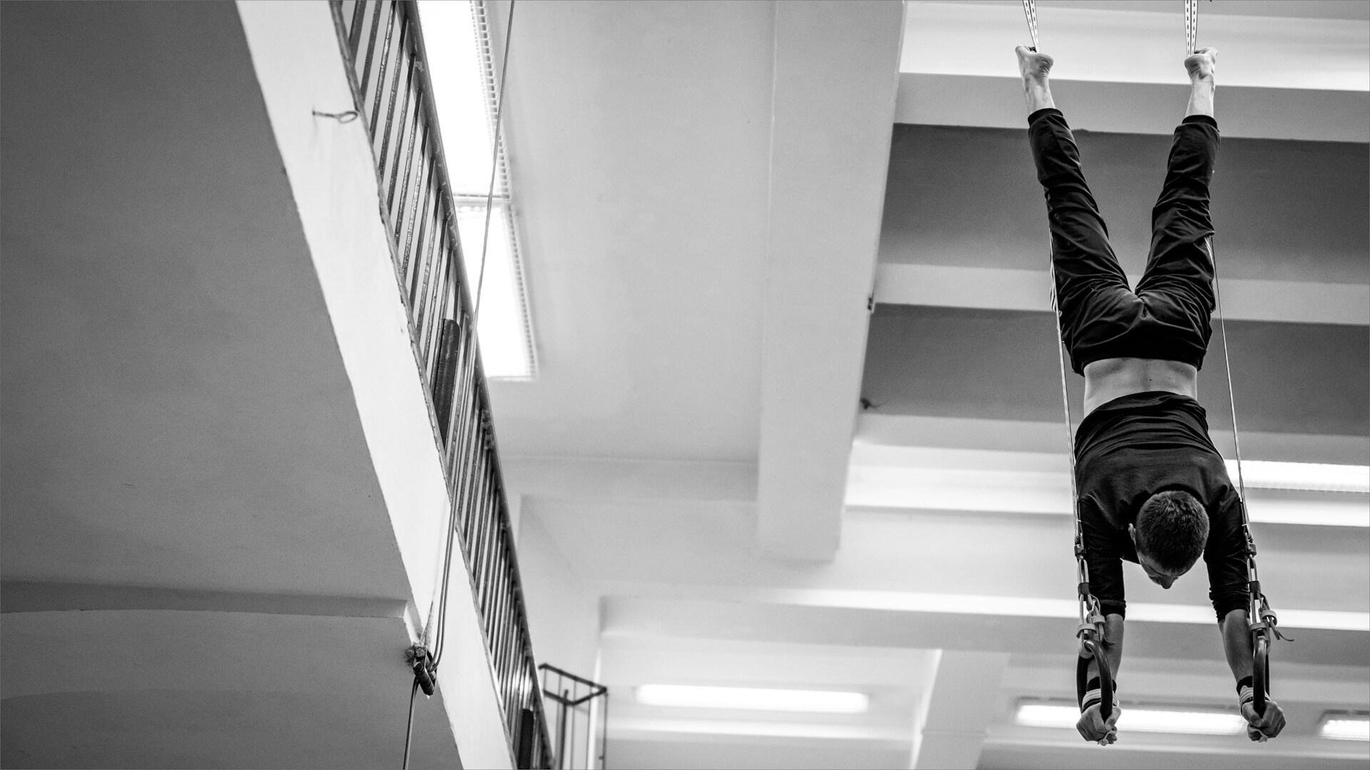 Black and white photo of a gymnast.
