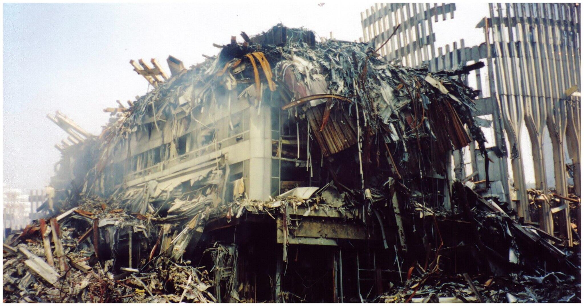 A photo of the collapsed buildings of the WTC.