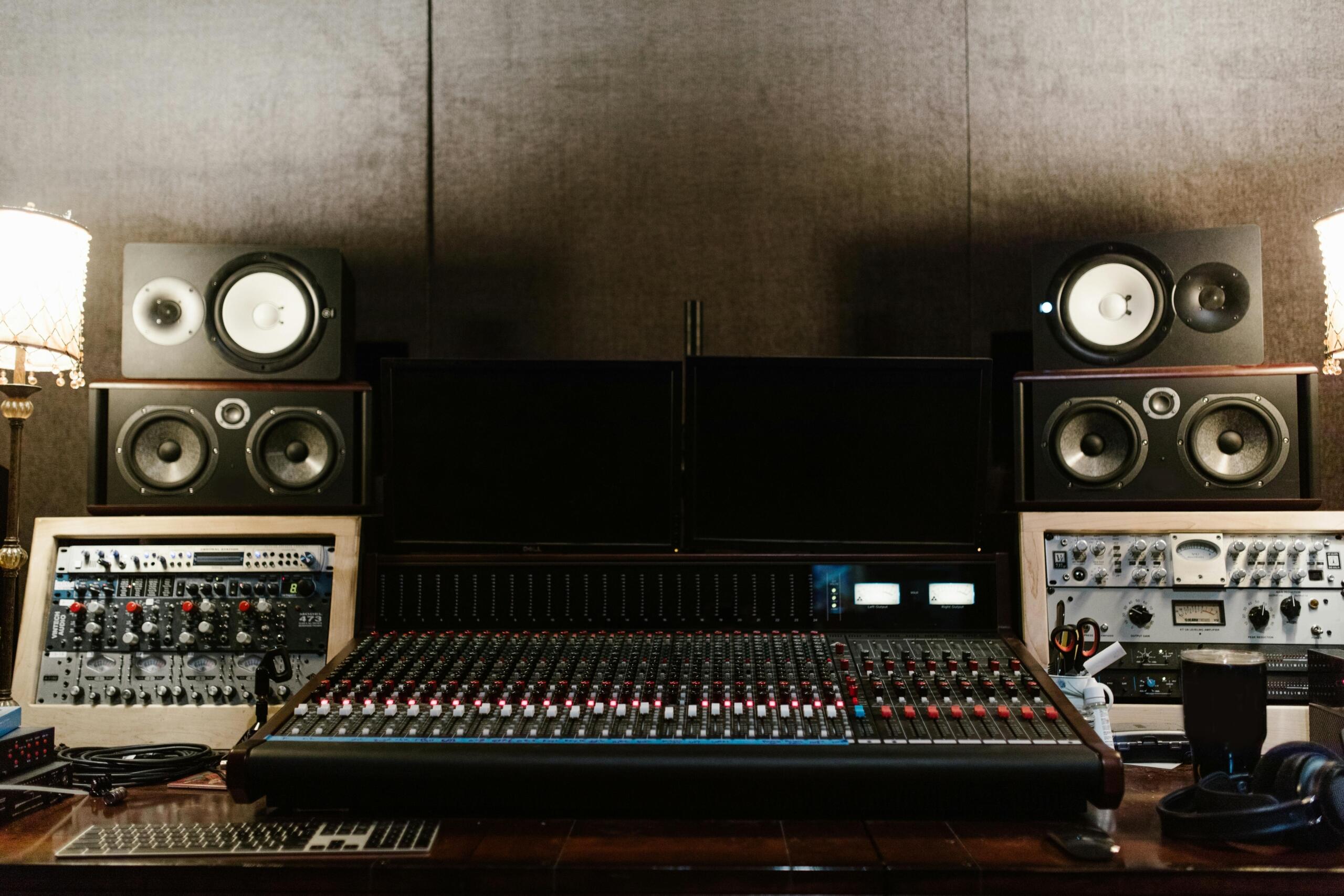 Amplifiers and a sound mixer in a professional recording studio, set up for music production.