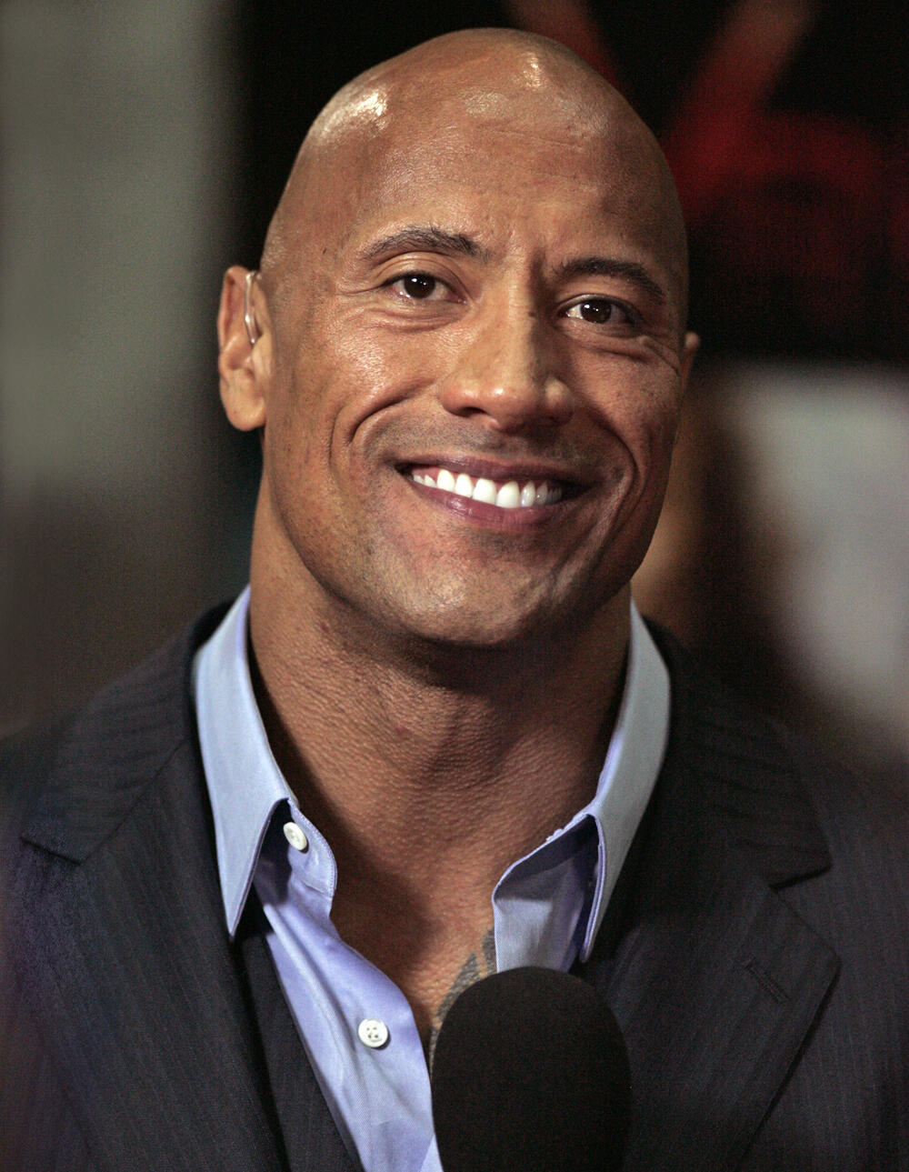 Dwayne 'The Rock' Johnson smiling at the camera.