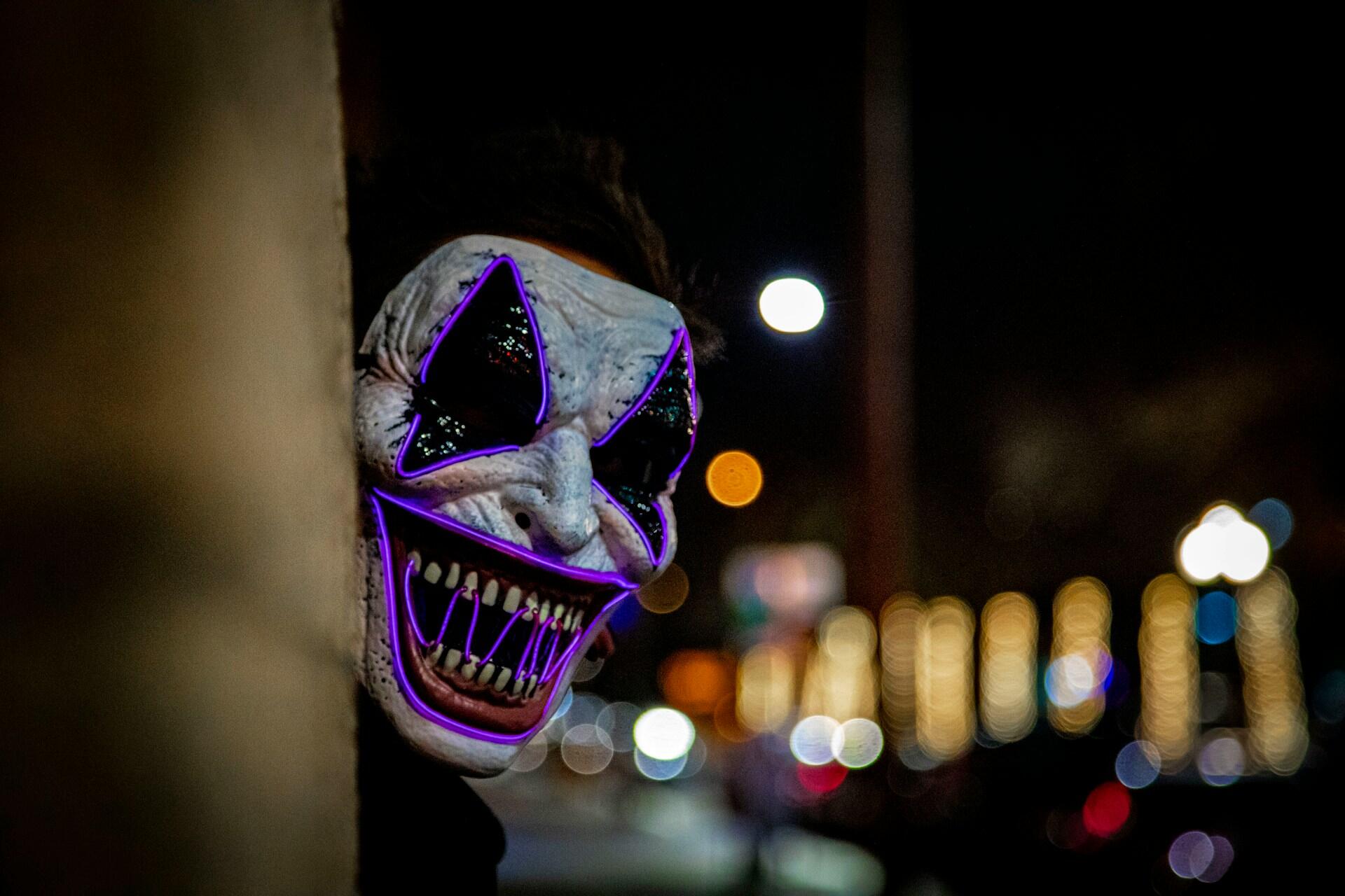 Scary mask smiling in a horror movie.