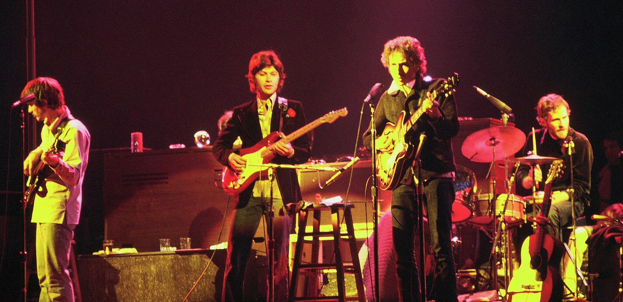 The Band performing on stage with Bob Dylan
