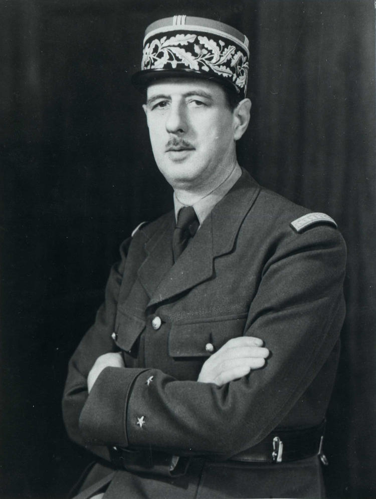 Charles de Gaulle in a black and white portrait.