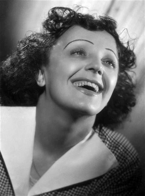 Edit Piaf smiling.