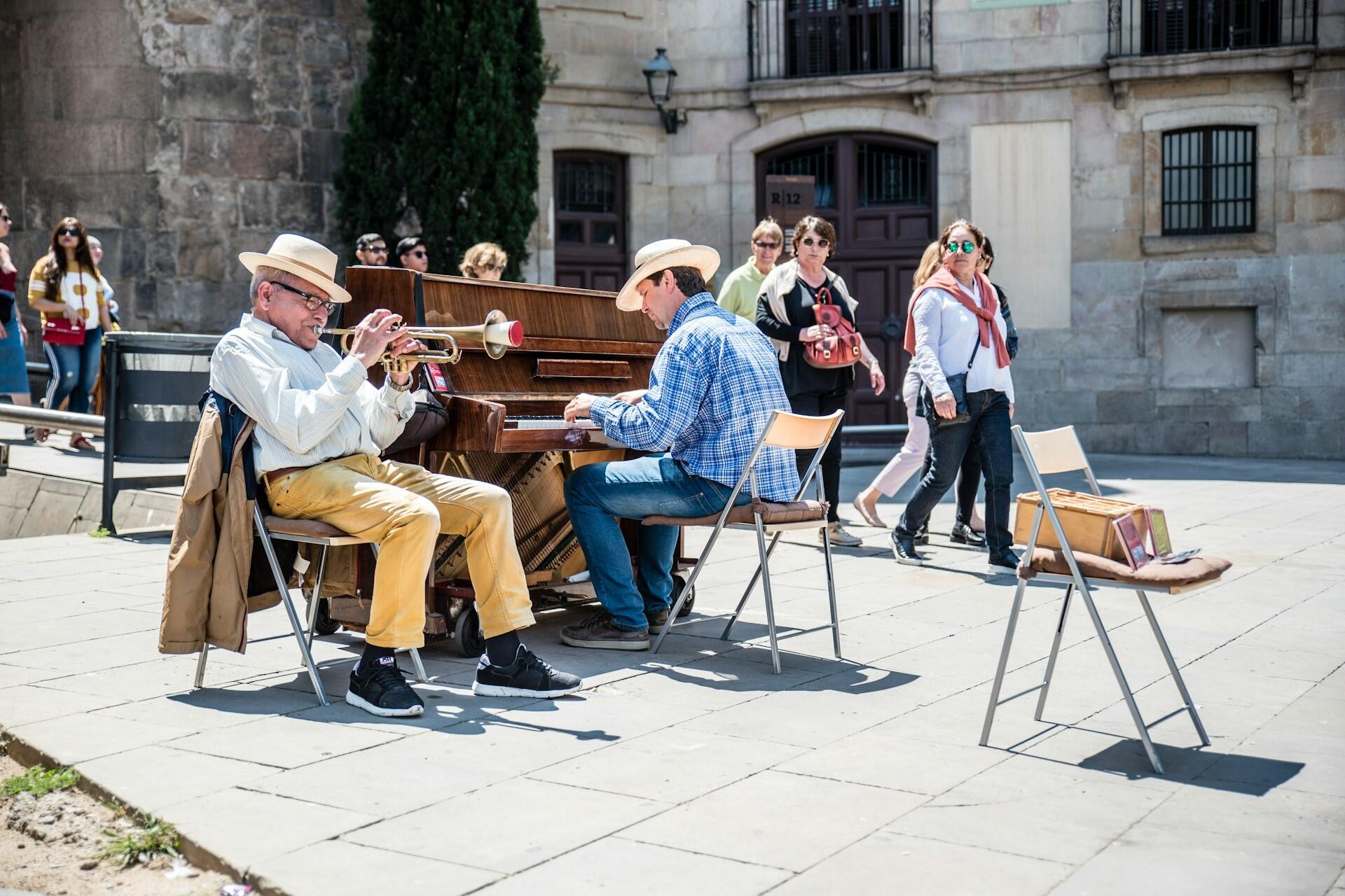 Spanish people on a plaza in Spain.