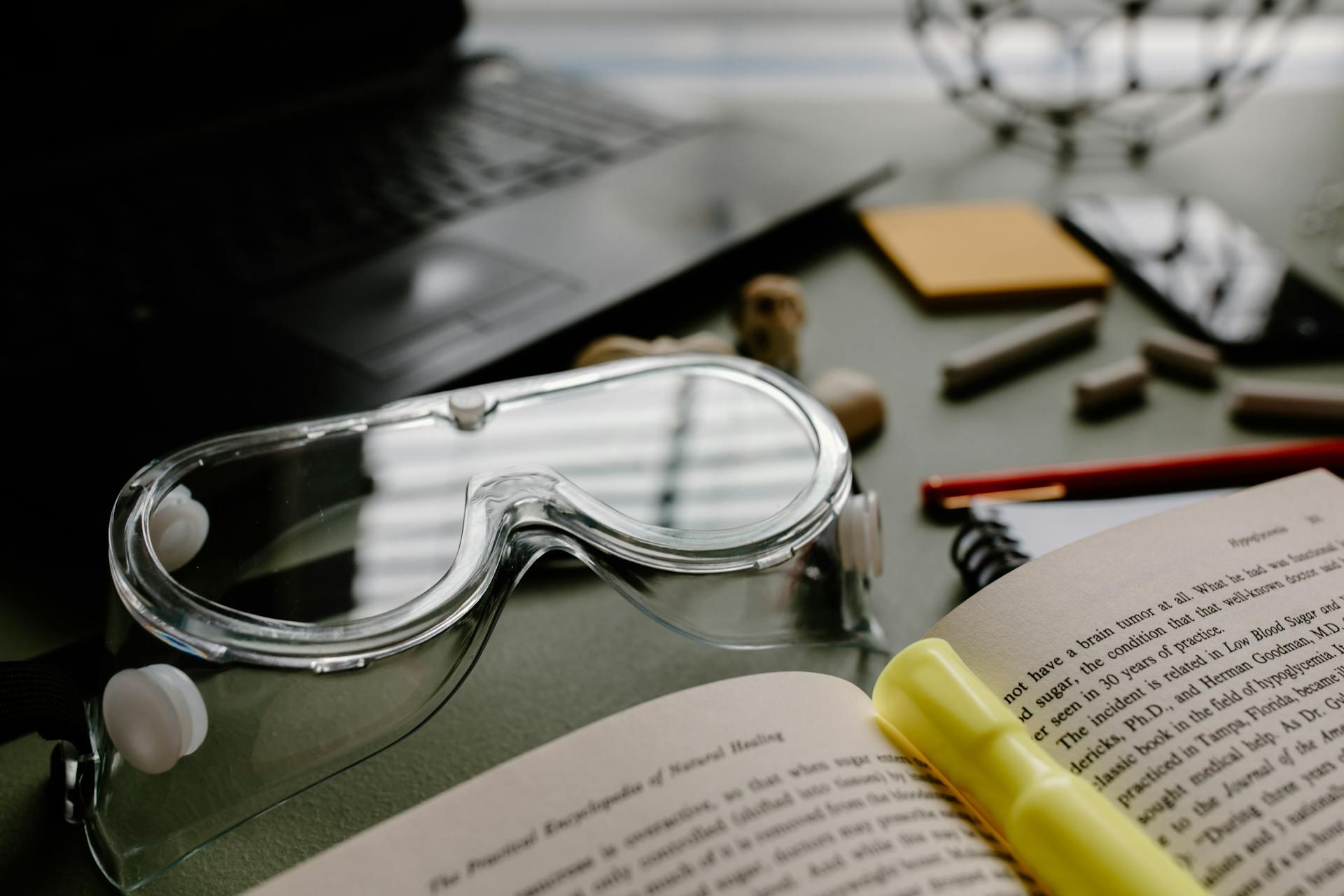 Nursing book and tools on a desk.