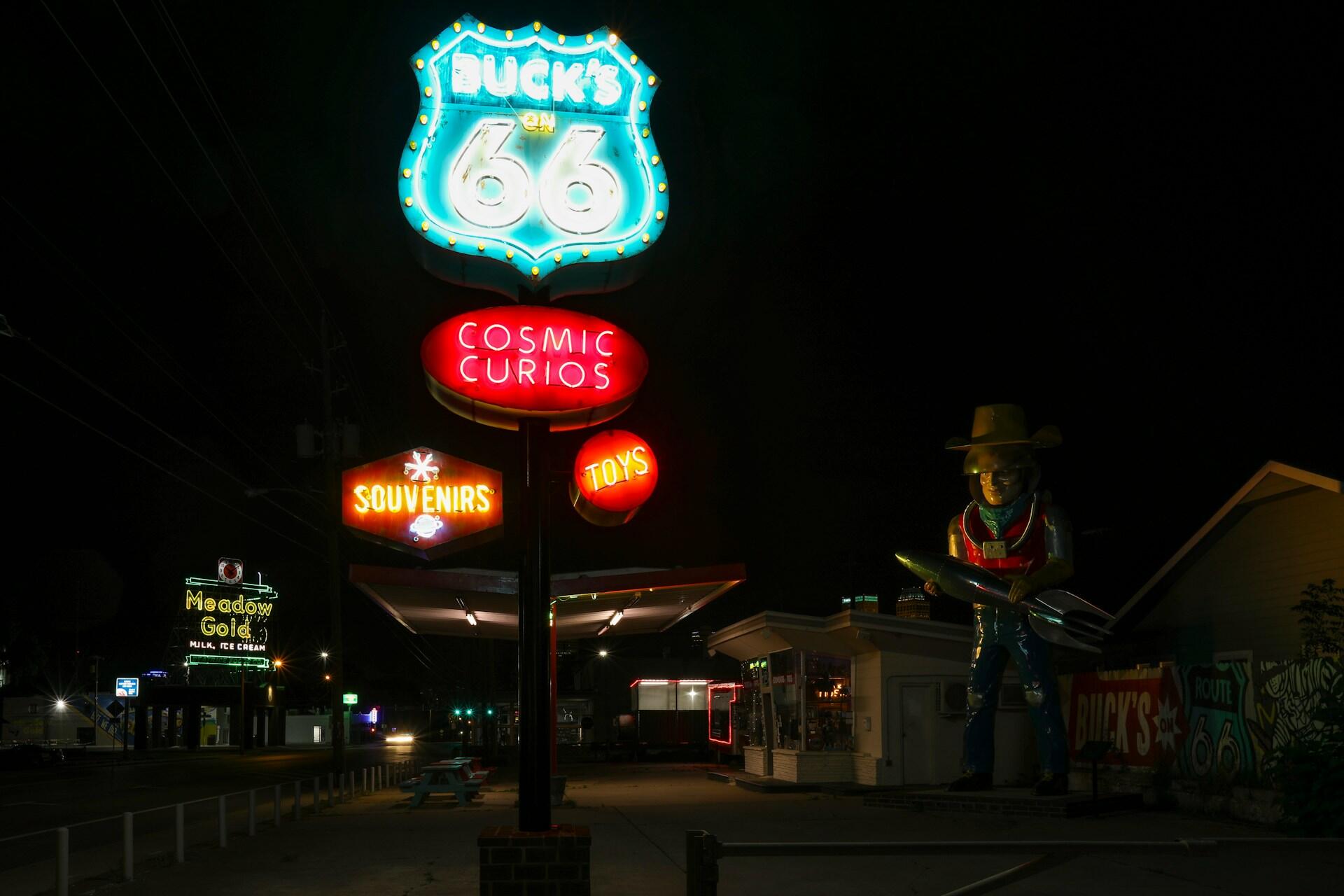 Route 66 neon signs at night.