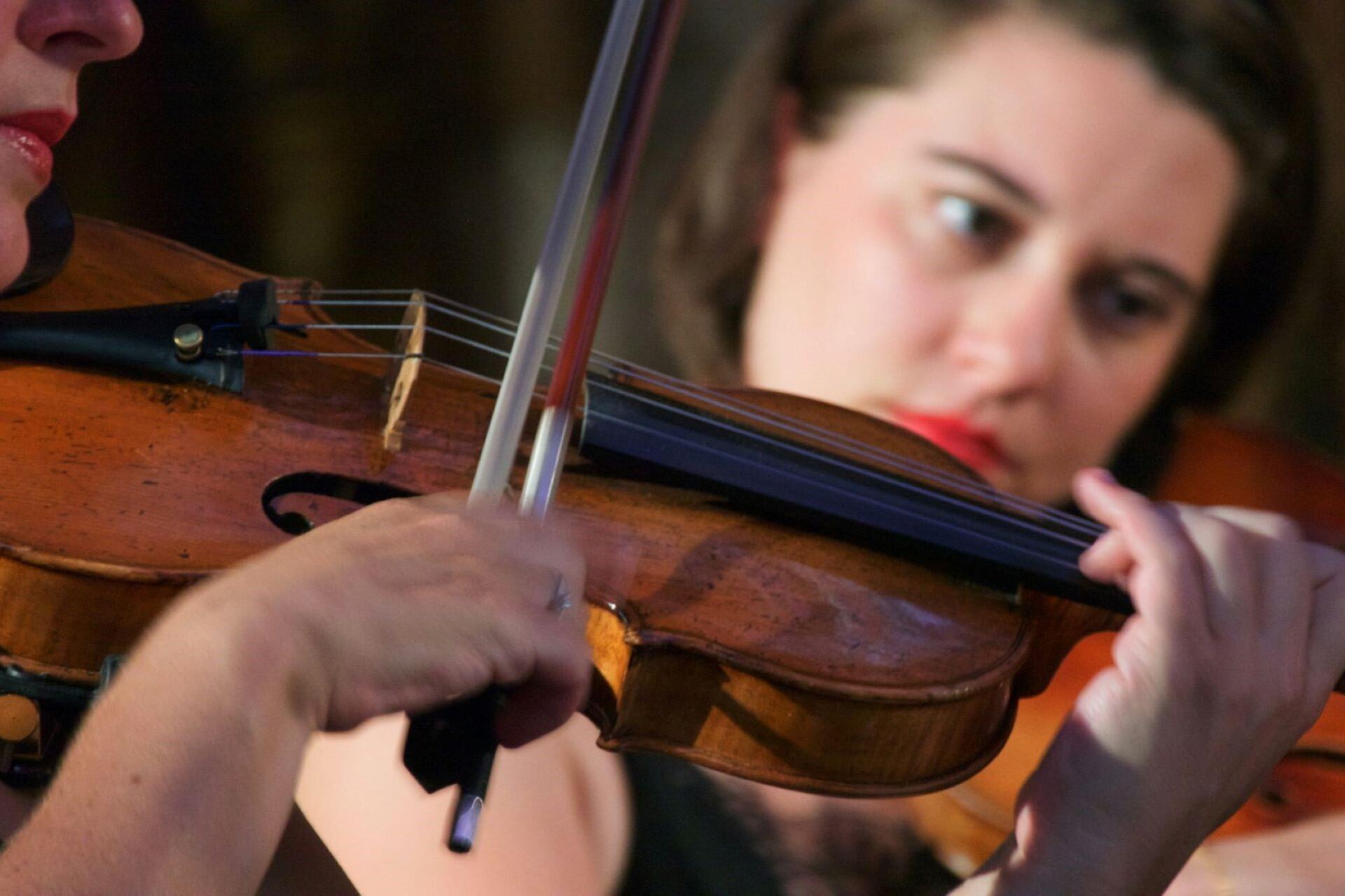 Two violinists during a performance.