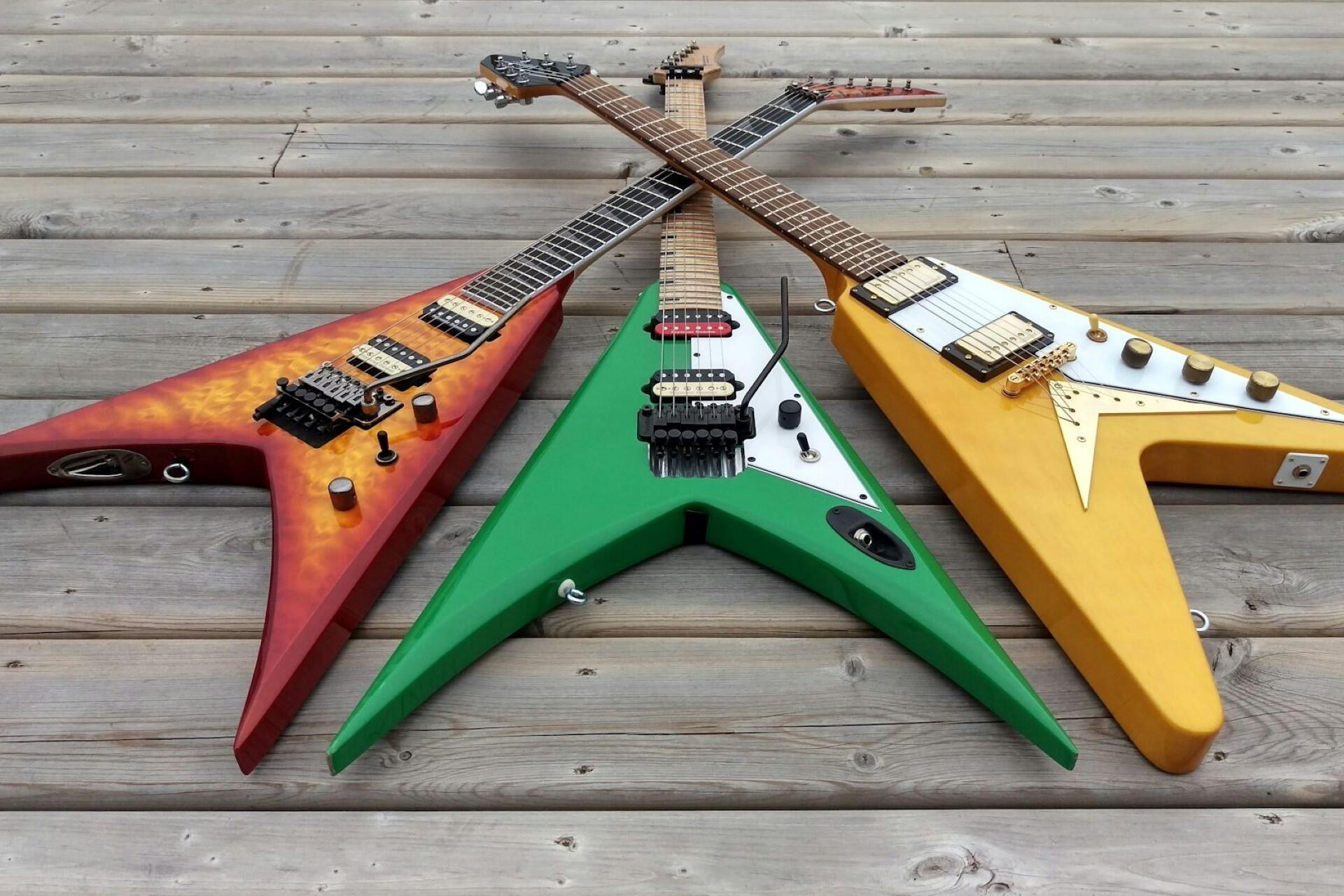 Various "Flying V" style guitar models.