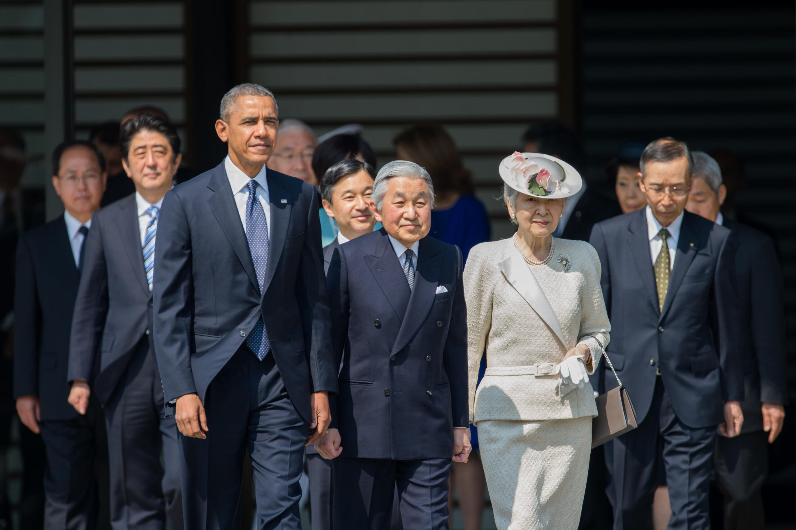 Obama walking with the Eperor and Empress of Japan.