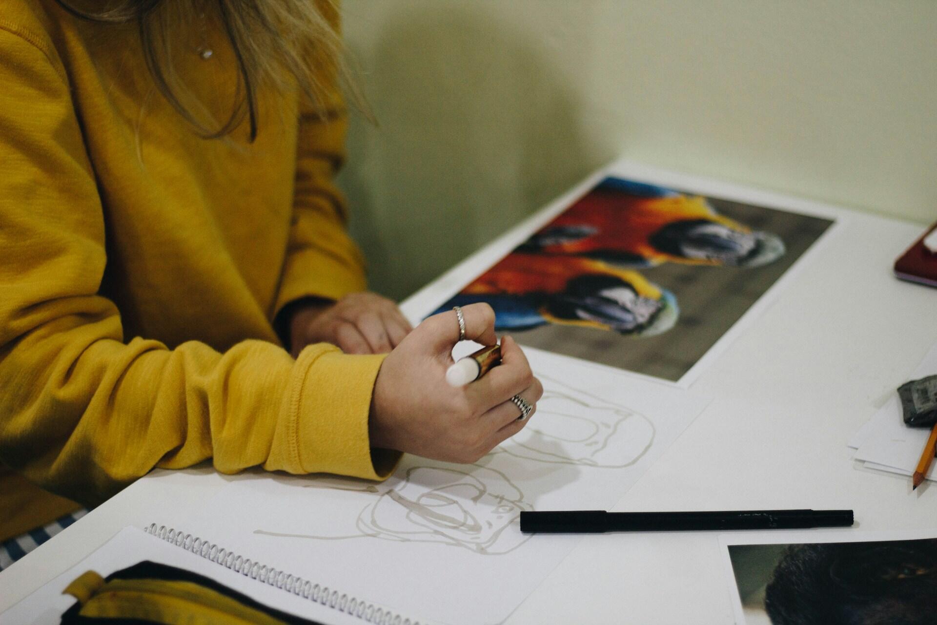 woman drawing and designing