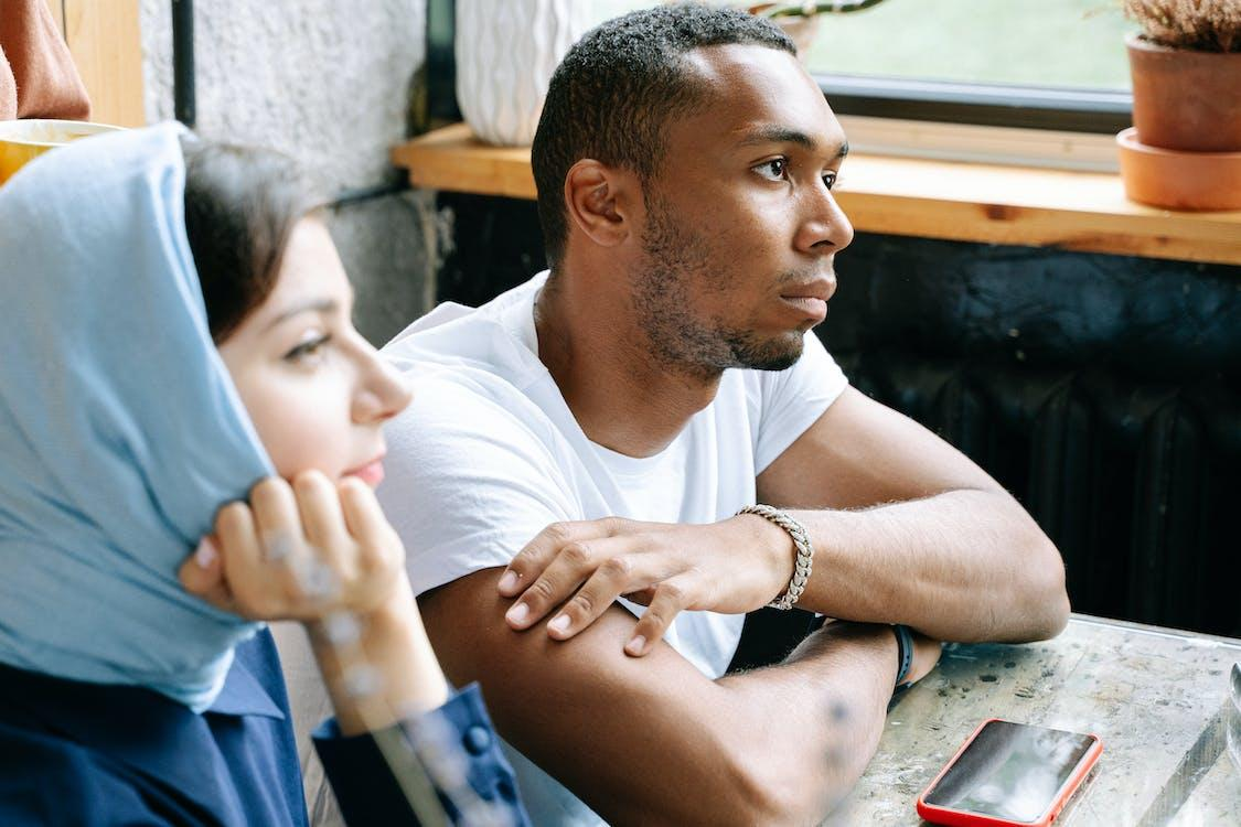 Two students at a nearby community college taking a lesson from a Korean teacher.
