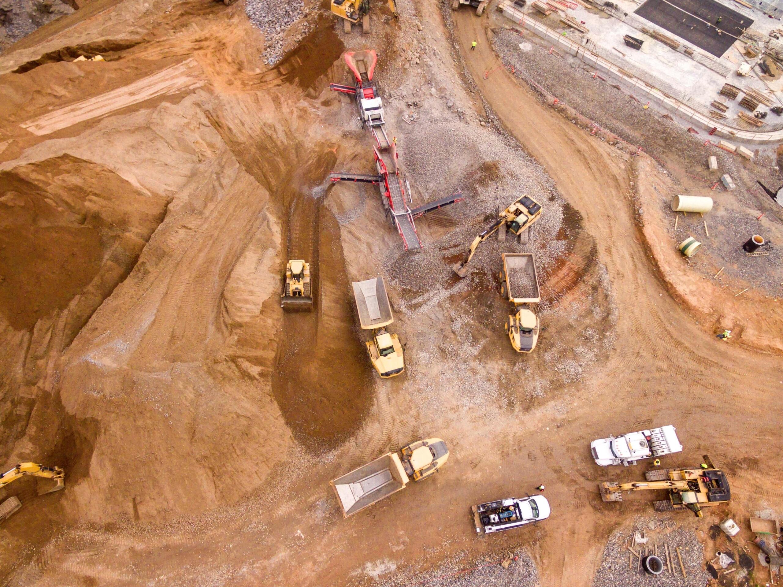 A mining site with trucks and equipment.
