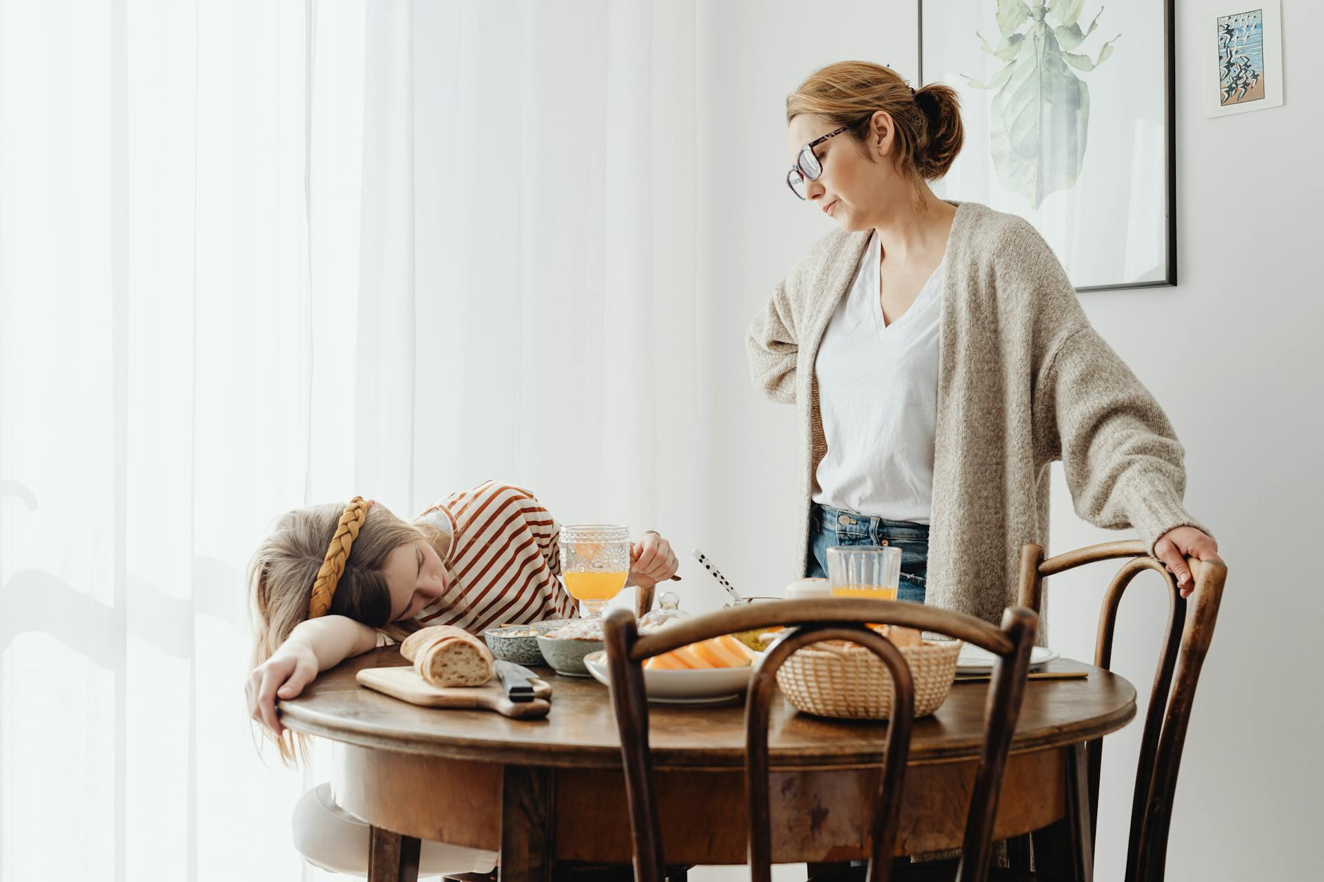 student falling asleep at the breakfast table