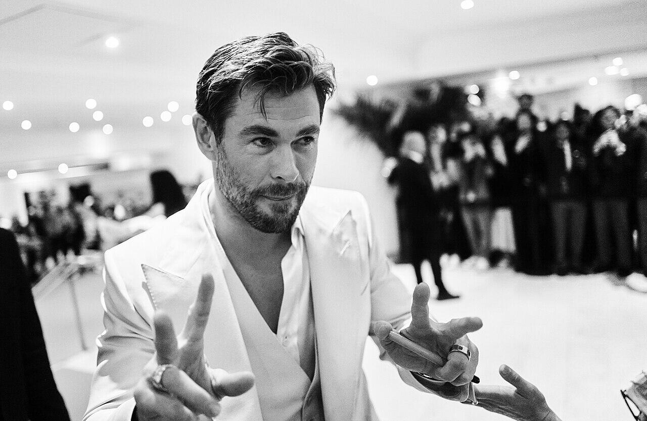 Black and white photo of Chris Hemsworth at the Cannes Film Festival.