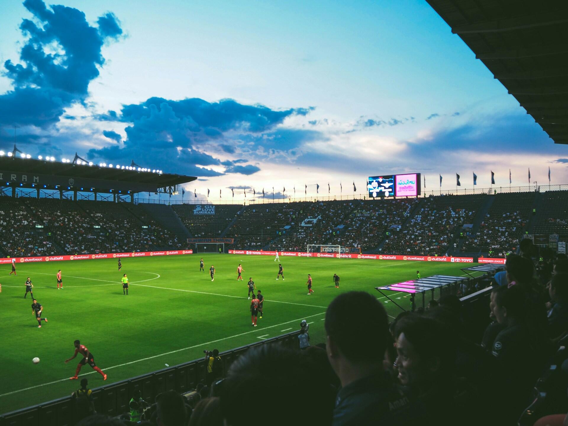 A soccer field at sunset.