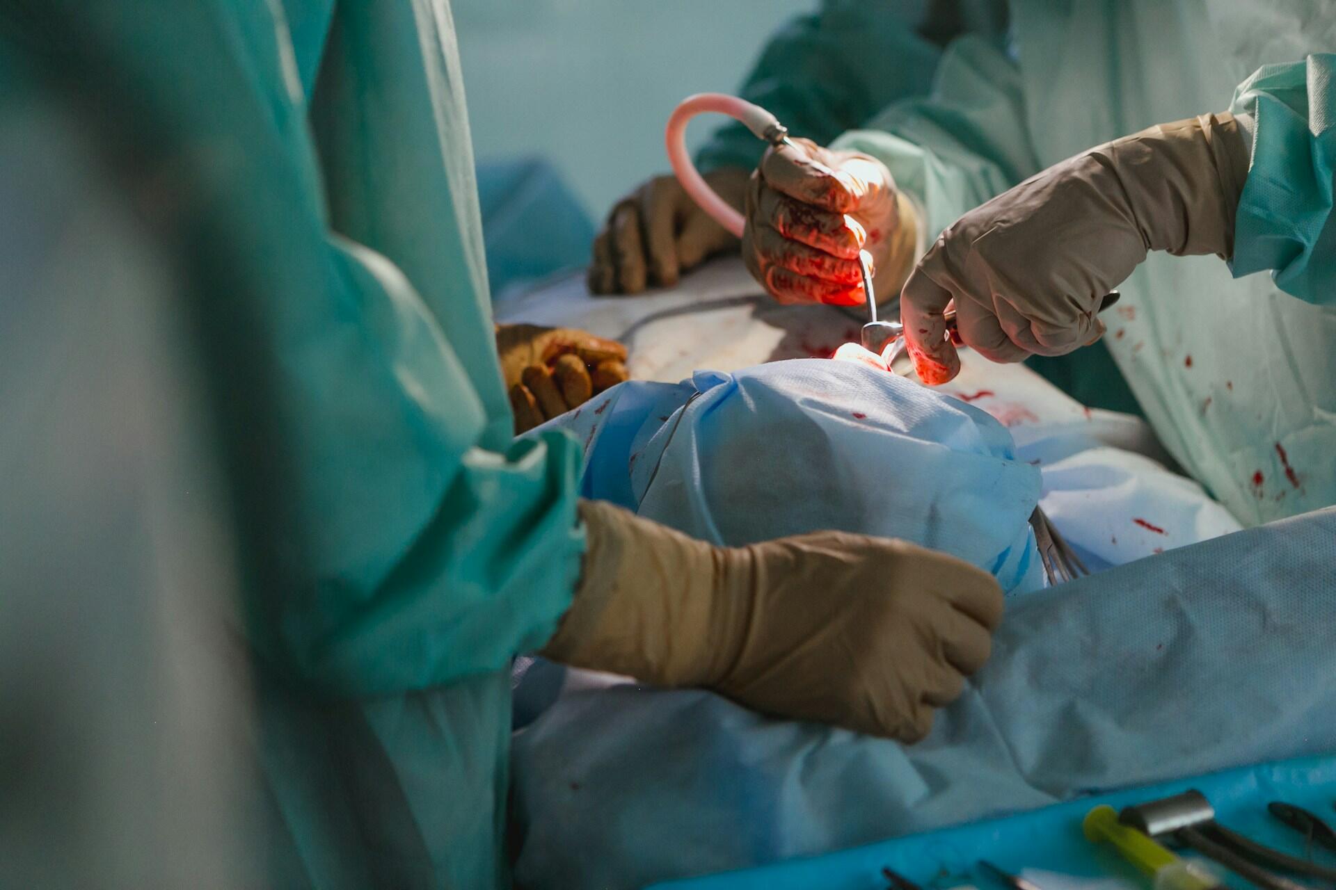 A doctor operating on a patient.