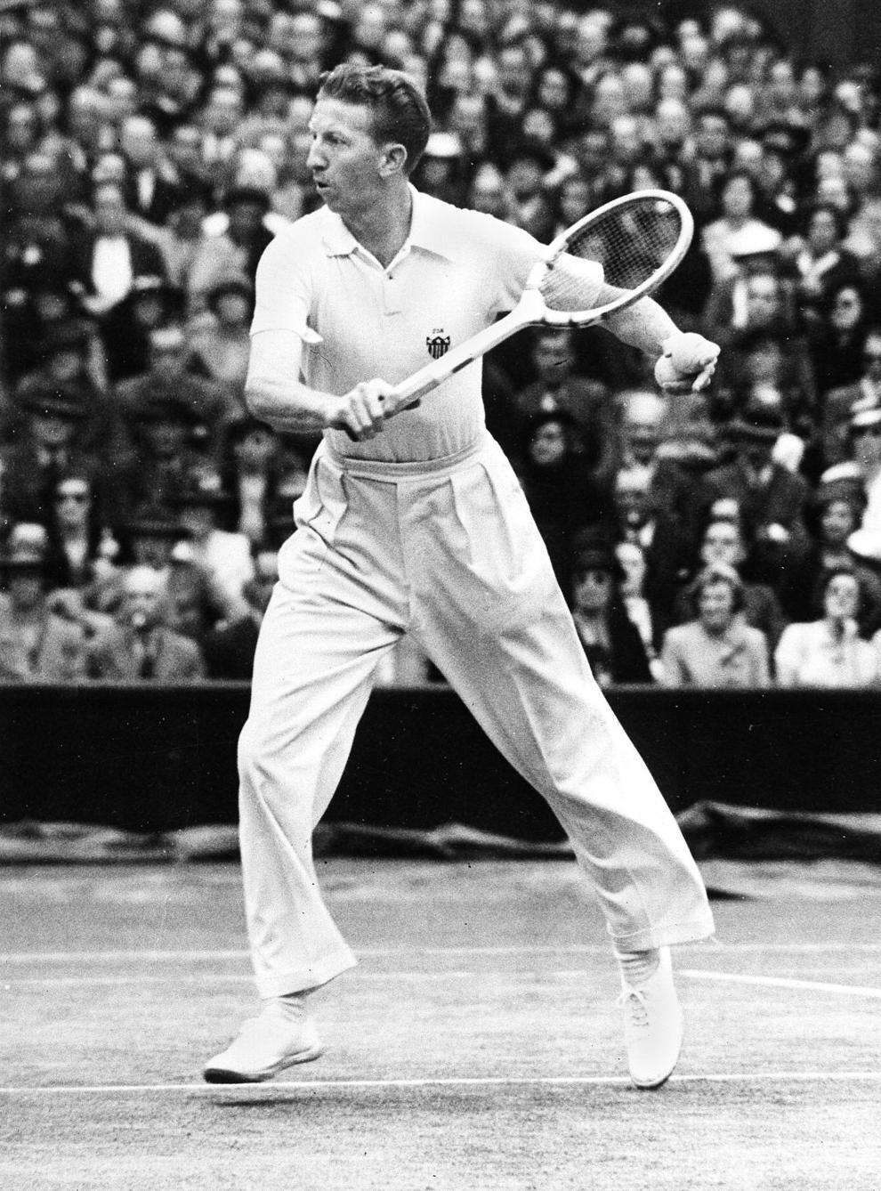 black and white photo of Budge competing at Wimbledon in 1938