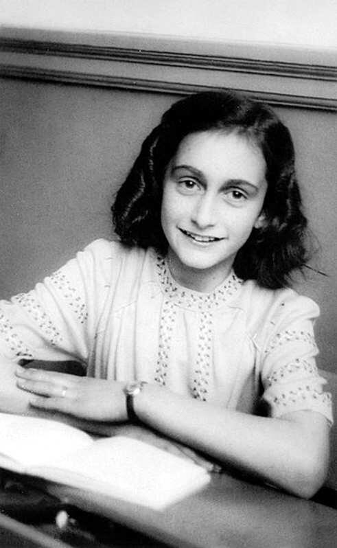 black and white photo of Anne Frank at school