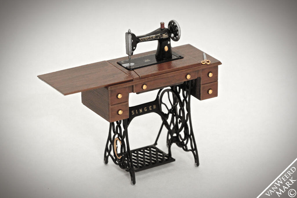 an old model of mechanical treadle sewing machine with pedal
