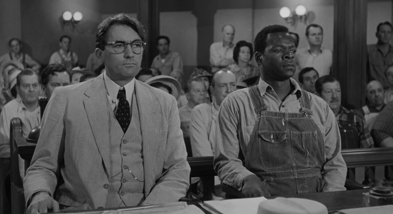 Atticus and Tom Robinson in the courtroom. 