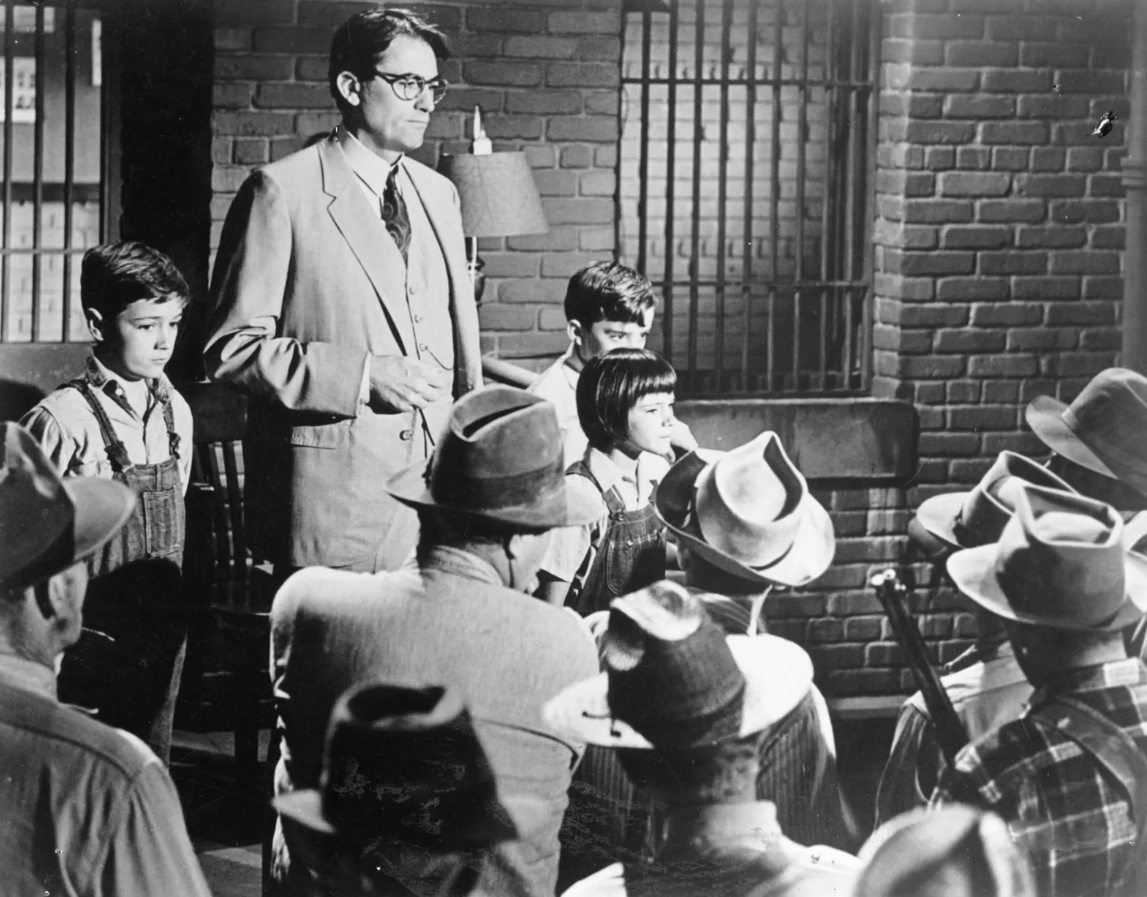 Atticus and the children defend Tom in the jailhouse, still from the 1962 film