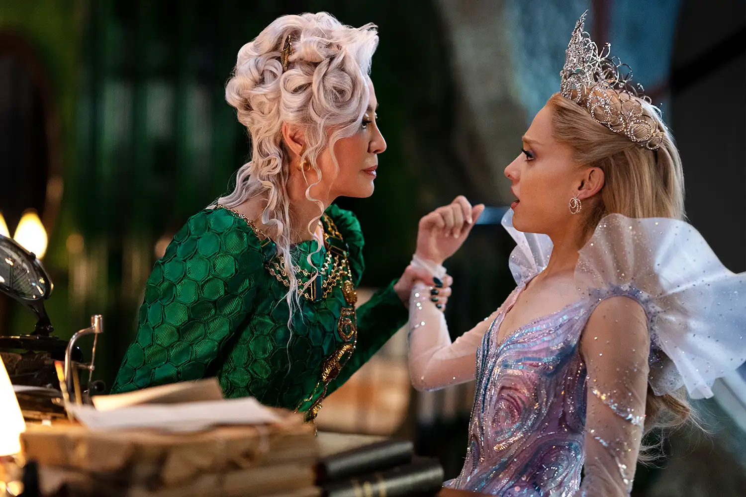 Madame Morrible (Michelle Yeoh) talking to Glinda (Ariana Grande)