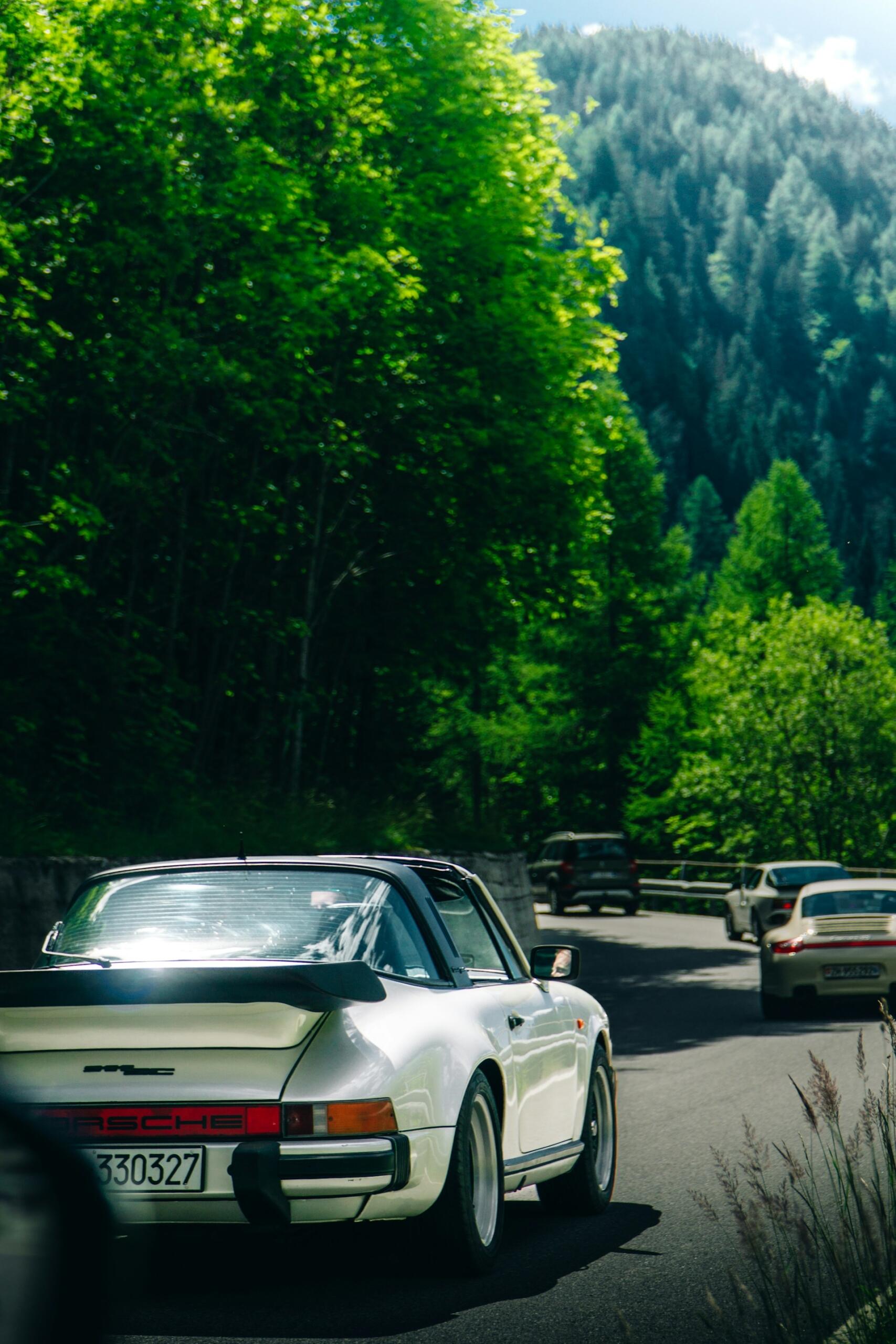 porsche cars on a mountain road