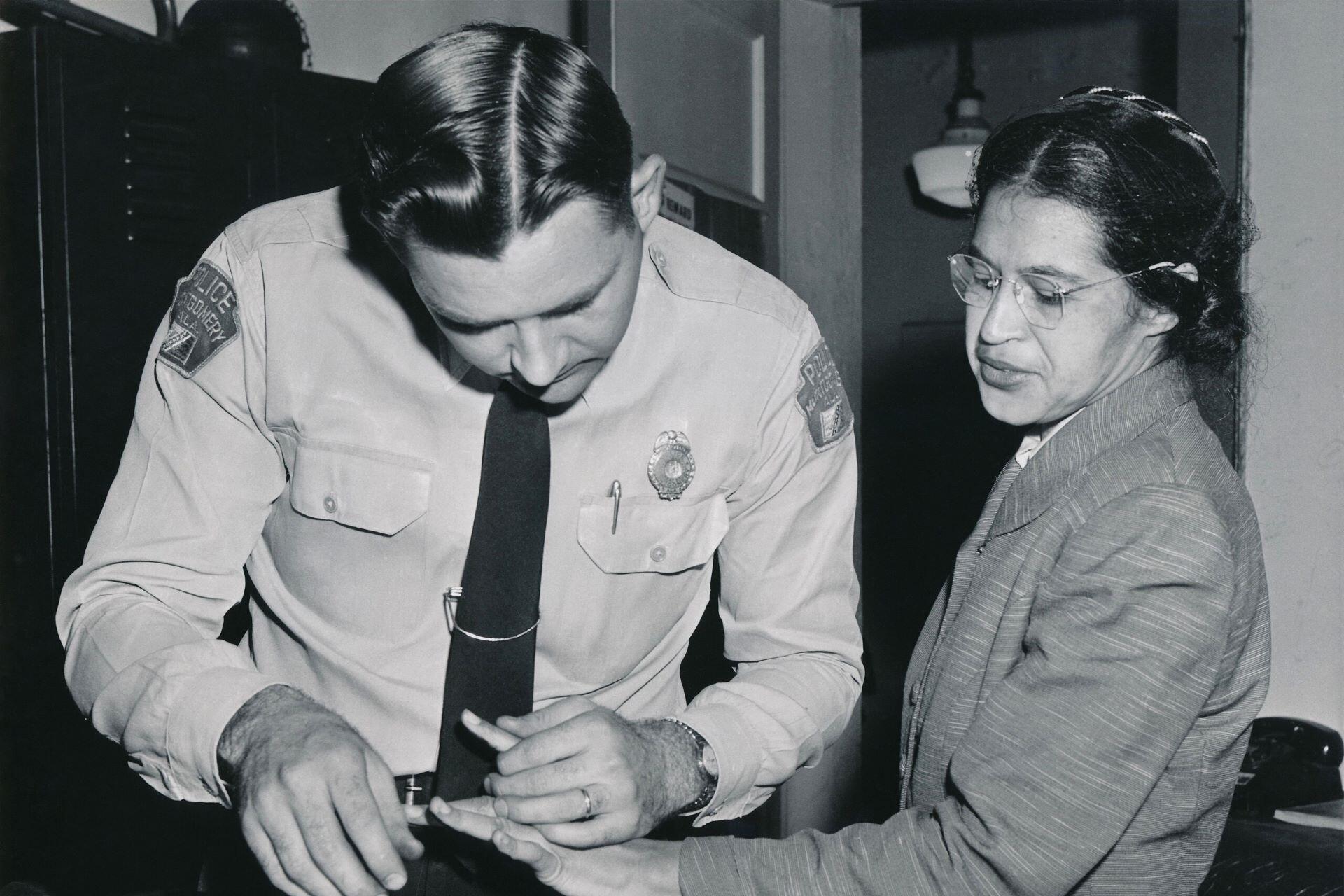Rosa Parks being arrested.