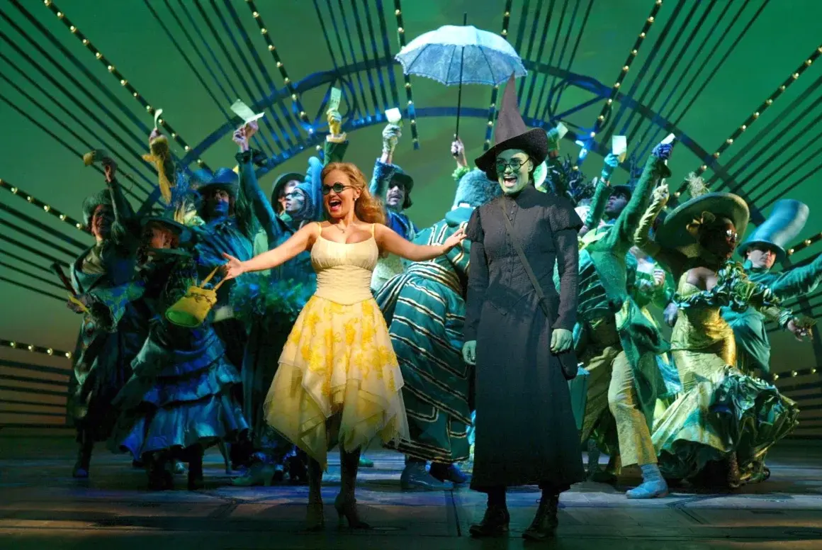 Chenoweth and Menzel on stage in Wicked on Broadway