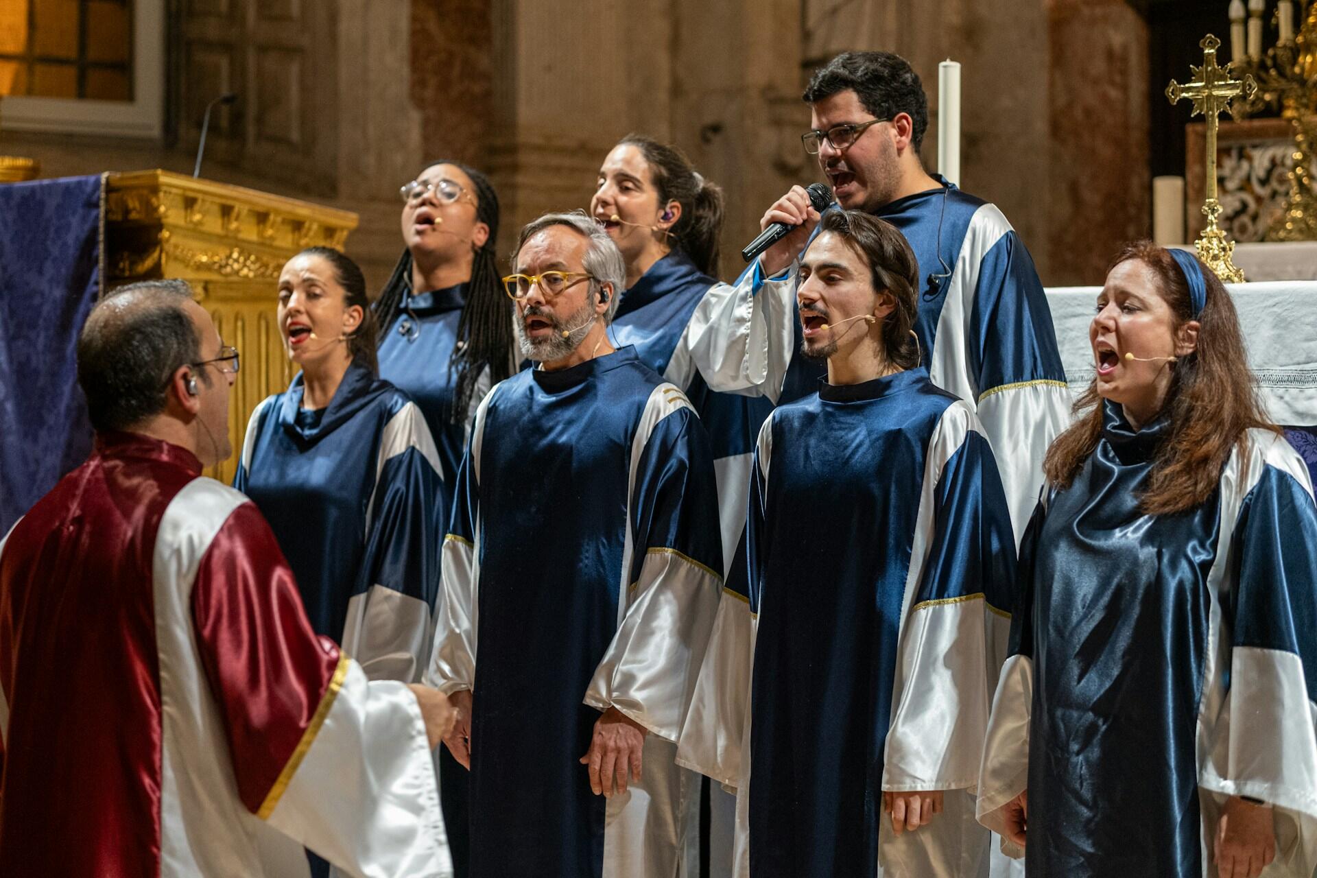 church choir dressed in robes singing in a service