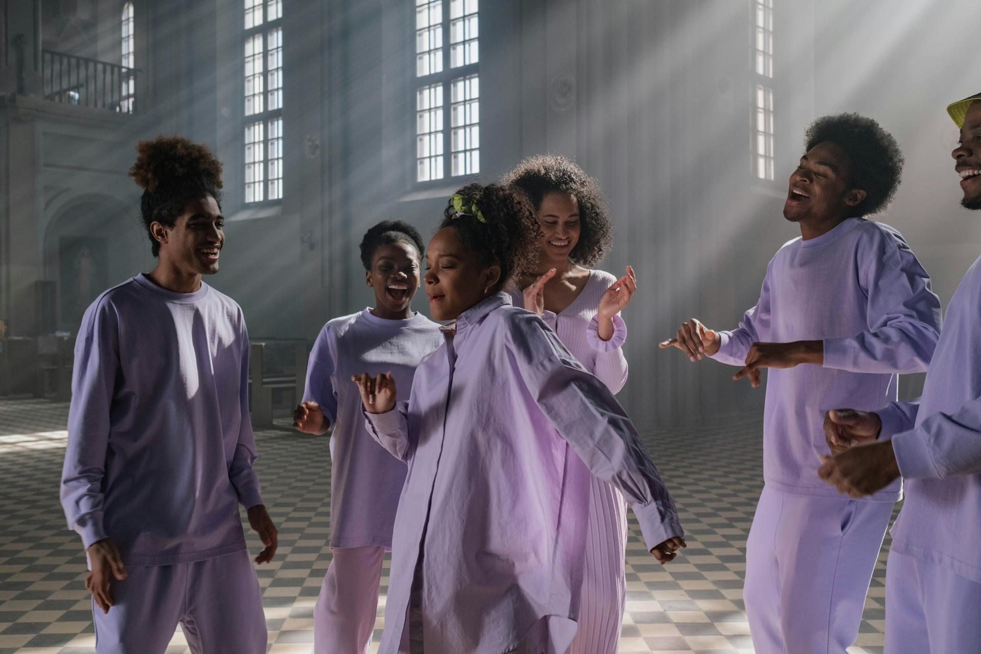 group of choir youths singing and dancing