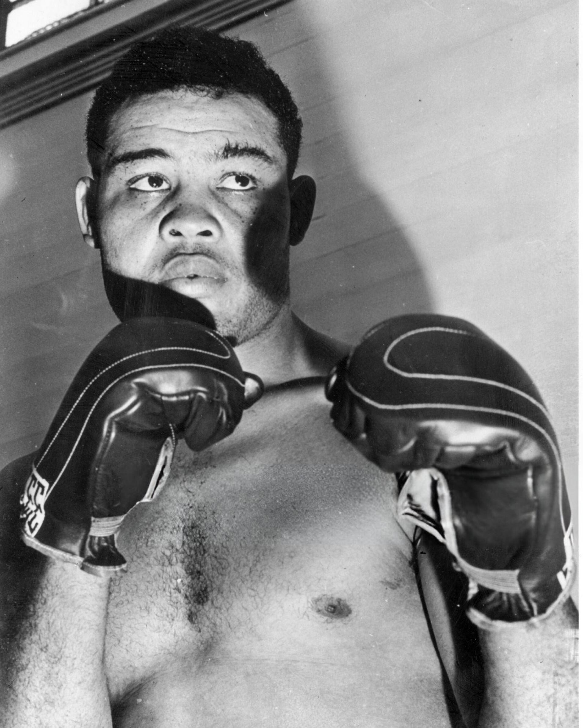 Joe Louis black and white training photo.