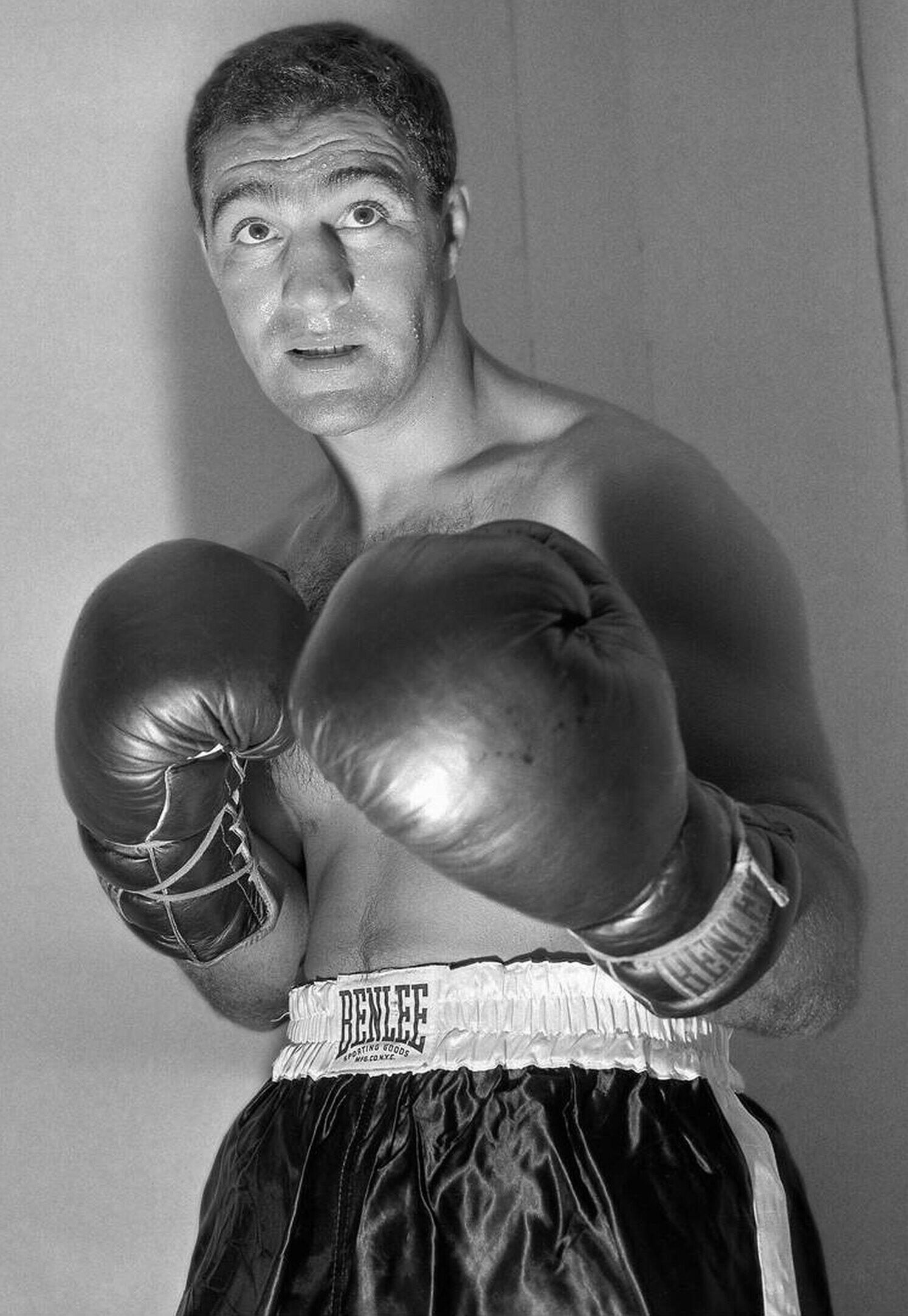 Rocky Marciano portrait in his boxing glove and uniform.