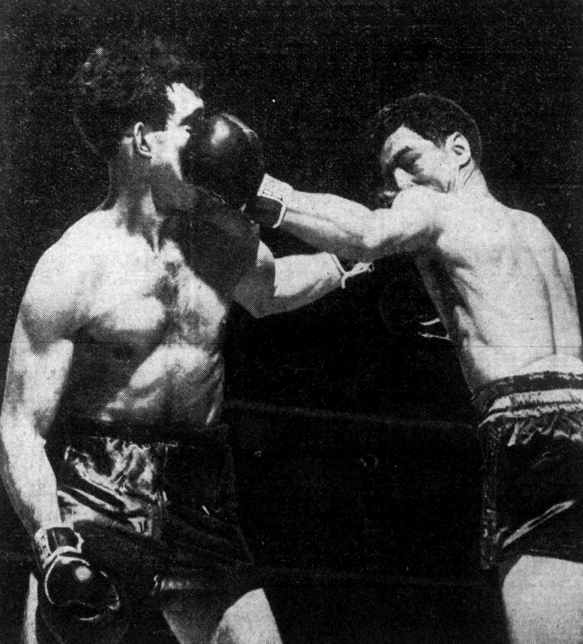 Willie Pep boxing match against his opponent in black and white.