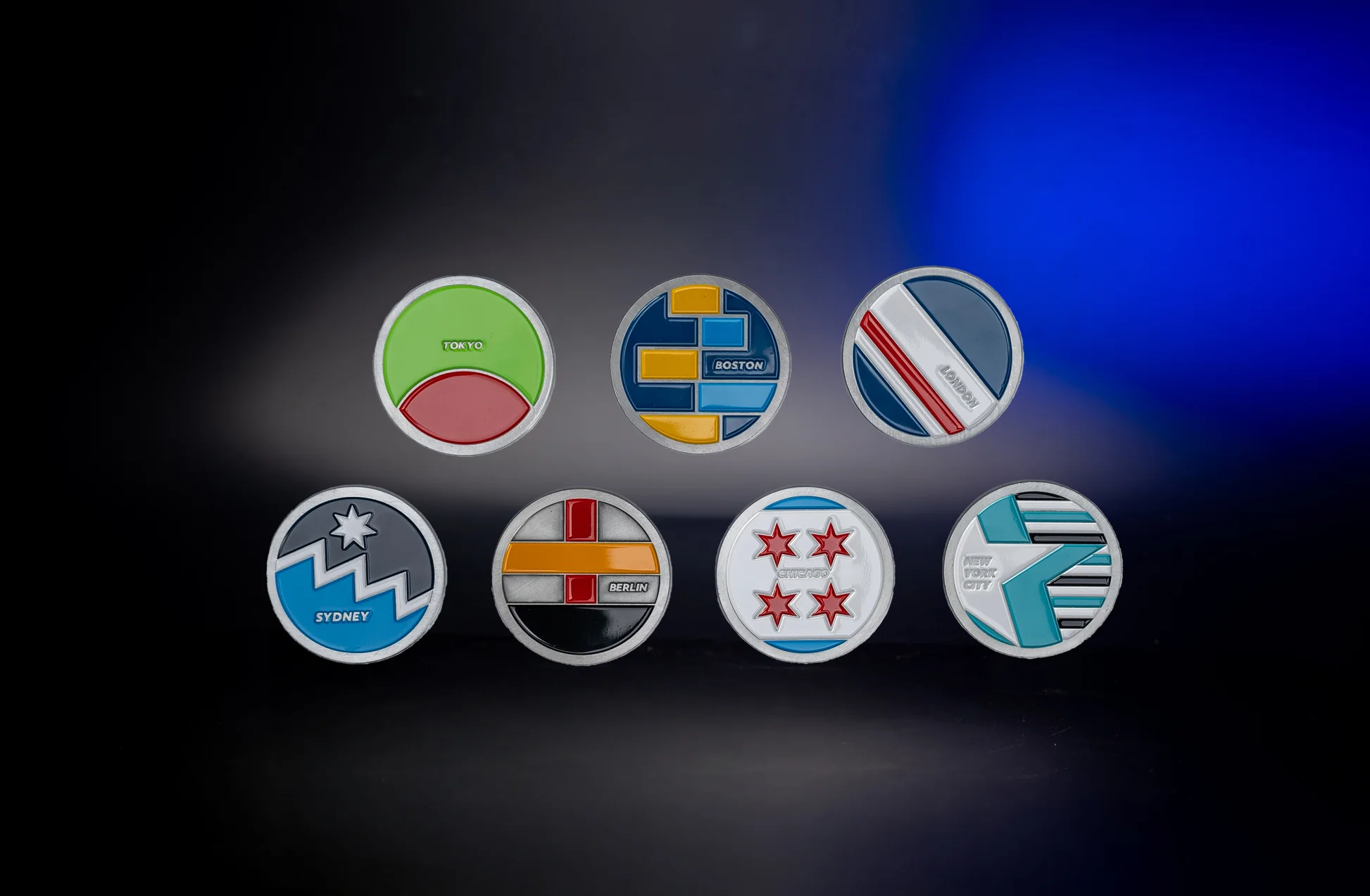 seven collectible coins each featuring a unique design representing a different marathon