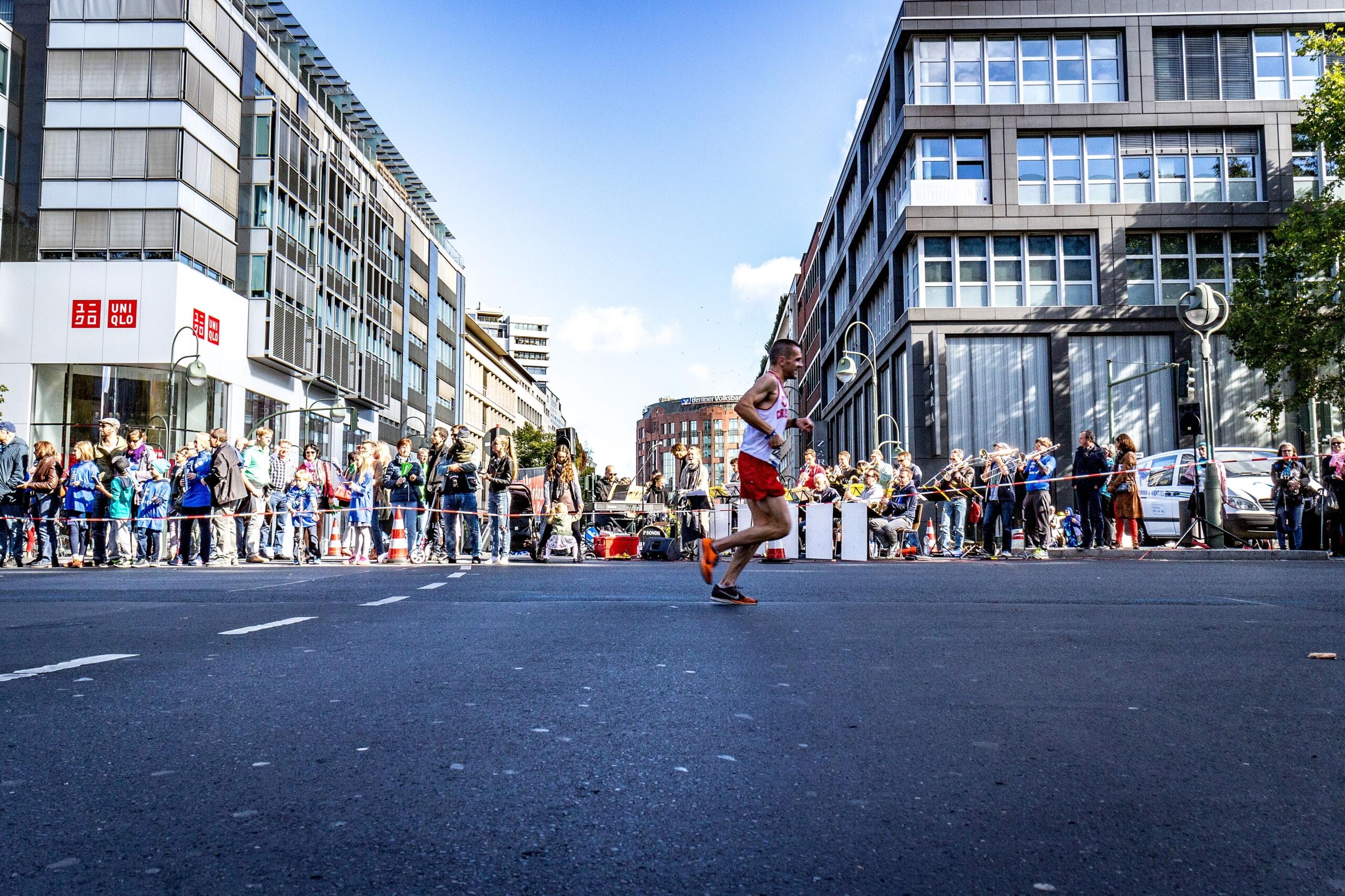 A marathon runner in the city portion of Berlin